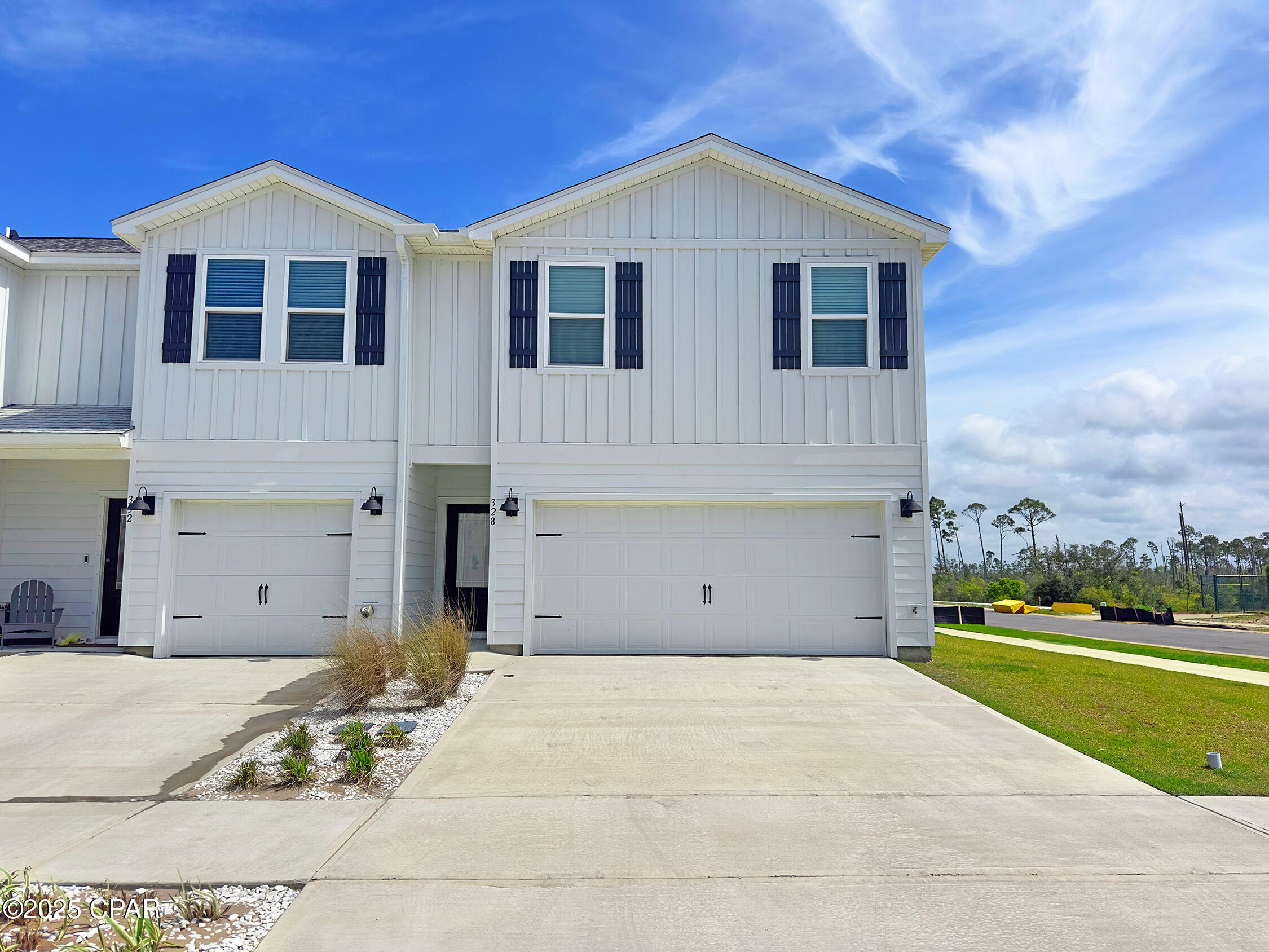 Welcome to 328 Salt Creek, a stylish 4-bedroom, 2.5-bath w/2 car carage this townhome has Gulf views, located in Salt Creek--Mexico Beach's newest townhome community on the peaceful eastern edge of Bay County. 
Location, location, location this bright, open-floor plan home has a view of the water and is located on a  a corner lot! 
Inside, you'll find high-end finishes like quartz countertops, stainless steel appliances, luxury EVP flooring, and white cabinetry with brushed nickel hardware. The spacious kitchen and living area are perfect for hosting friends or relaxing after a day at the beach, and all four generously sized bedrooms are upstairs, giving you a private retreat to unwind.
Built with coastal durability and modern style in mind, this home features Color-Plus Hardie Board siding, prairie-style doors, and 30-year dimensional shingles. The two-car garage comes with steel doors and automatic openers, while exterior entries are secured with Kwikset deadbolts. You'll also find thoughtful extras like weather-resistant outlets and hose bibs, so you're fully prepped for the beach lifestyle.