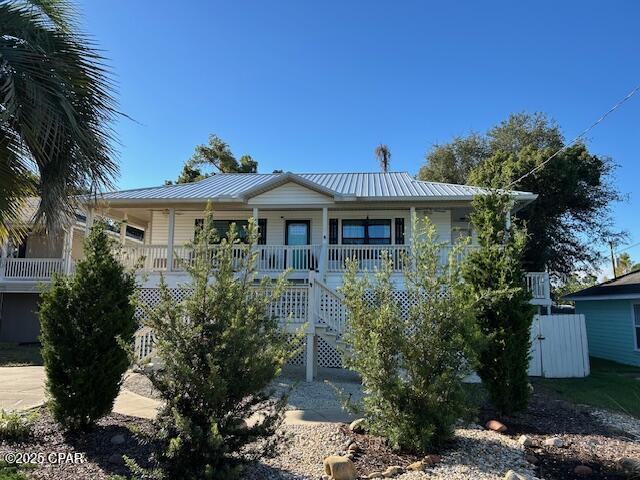 'CURRENTLY UNDER CONTRACT, SELLER WILL CONSIDER BACKUP OFFERS   This 3/2 home is coastal living at it's best.  Near Navy base , restaurants, and shopping, It stays high and dry on its stilts with lots of storage space below.  It is nestled in a quiet neighborhood less than 5 minutes from white sandy beaches.   Plenty of curb appeal here with an inviting hardscape in front including an extra parking corral plus a welcoming front porch with fans.   A huge screened porch that opens onto an open deck spans the back of the house for grilling or relaxing.  Outdoor Shower and lots of storage below