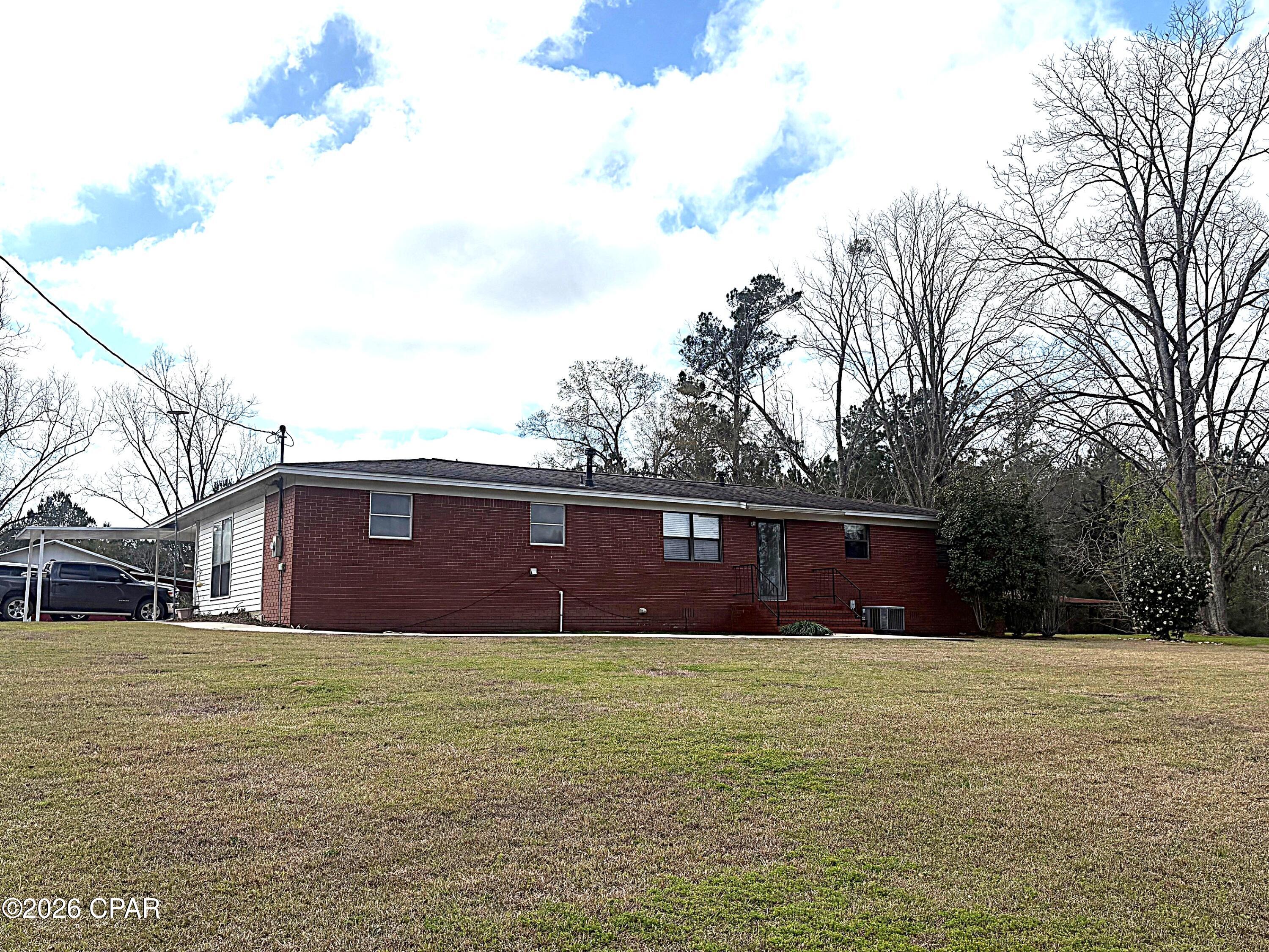 GREAT COUNTRY LIVING ON 2.61 ACRES. This updated home has 1840 heated square foot, 3BR's/2Baths, barns and out buildings, Pecan trees, pear trees, scuppermong vine and big garden space. The home has had many updates through out the home including new interior paint through out, electrical upgrades and also Seller has a new survey to provide to the new owners..  Hill top views, quiet country living at it's best.
