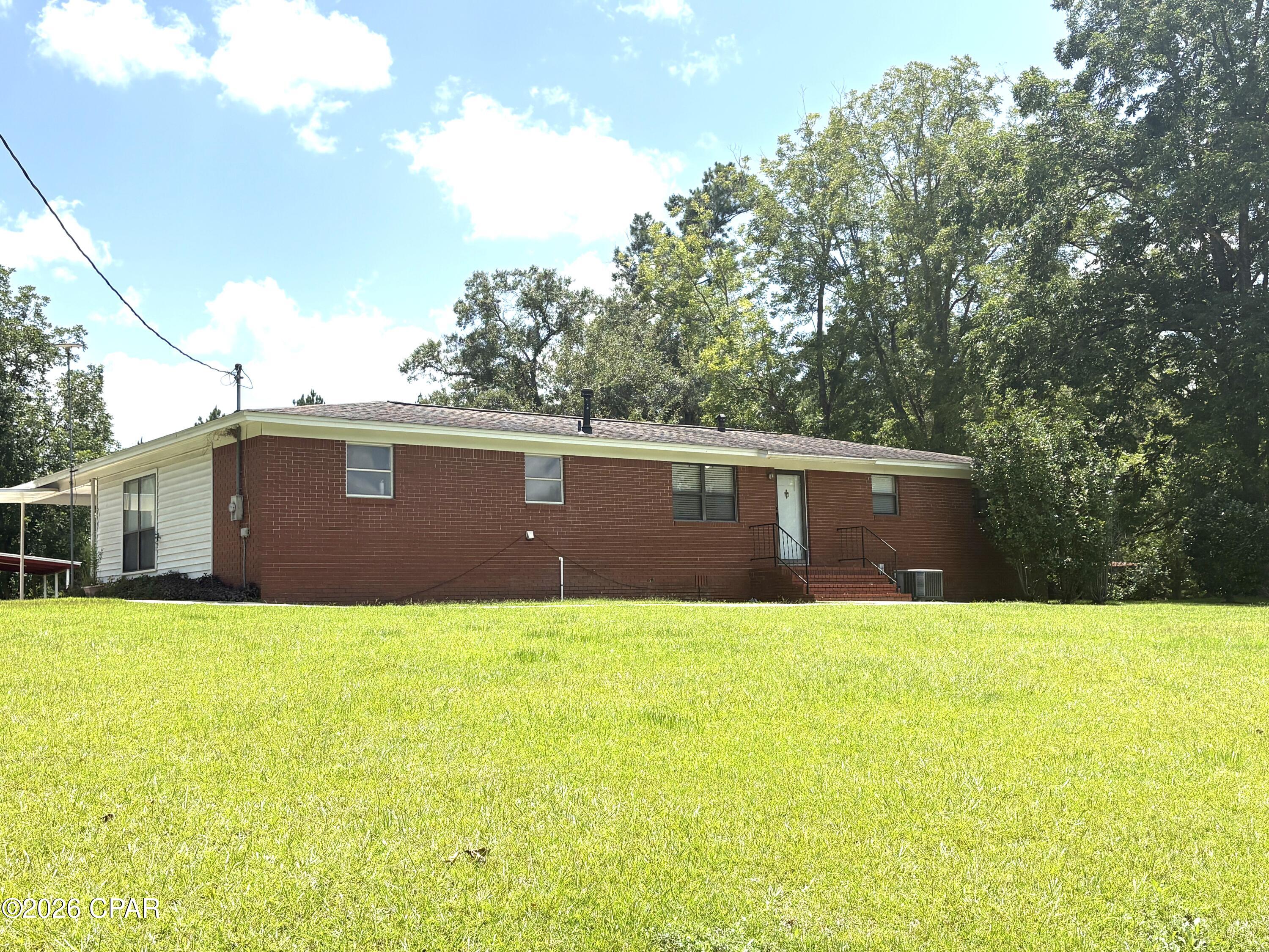 GREAT COUNTRY LIVING ON 2.61 ACRES. This updated home has 1840 heated square foot, 3BR's/2Baths, barns and out buildings, Pecan trees, pear trees, scuppermong vine and big garden space. The home has had many updates through out the home including new interior paint through out, electrical upgrades and also Seller has a new survey to provide to the new owners..  Hill top views, quiet country living at it's best.