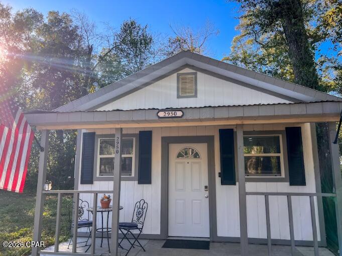If you're searching for a welcoming retreat near Florida State University, don't miss this charming bungalow by Lake Bradford. This freshly renovated, 1-bedroom, 1.5-bath home features an open floor plan and sits on over a quarter acre, surrounded by mature trees for added privacy. Enjoy relaxing mornings or peaceful evenings on the spacious front covered porch or in the large yard. The kitchen features an upgraded electrical system to support modern appliances, including new multicolor stainless steel appliances such as an oven, stove, refrigerator, sink, and faucets. Enjoy brand new vinyl flooring, new windows, and new doors, including upgraded barn doors installed throughout. New drywall, flat ceilings, along with the brick veneer accent wall give this home an elegant atmosphere you will want to return home to day after day. Also included is a new washer and dryer, and an insulated attic offers usable storage space above the bedroom. Enjoy new recessed LED lighting inside and on the patio, a new concrete patio with overhang, and an efficient new water heater. The home includes a year-and-a-half-old mini split system and all-new plumbing throughout. Both the full and half bathrooms have been completely updated with new plumbing, toilets, and a stylish corner shower equipped with a new, high-quality shower head. The septic tank was inspected in June 2024 and found to be in excellent condition, requiring no maintenance at that time.