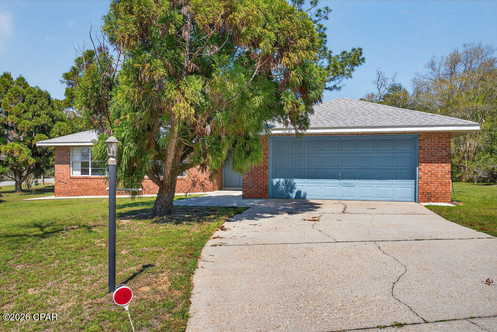 Welcome to 4006 Oak Hill Road, a 3-bedroom, 2-bathroom brick home situated on a corner lot in the Sunny Hills community. Offering approximately 1,765 square feet of living space on 0.368 acres, this home features a functional layout with multiple living areas and plenty of room to spread out.

Inside, you'll find a spacious living area that flows into the dining room, creating an open setting for everyday living. In addition to the main living space, a separate family room provides added flexibility for a second living area, home office, or hobby space. The kitchen includes a bar area for additional seating, making it a great spot for casual meals or gathering.

The split-bedroom floor plan offers privacy, with the primary suite separated from the additional bedrooms. The home also features an attached sunroom, providing additional living space filled with natural light--perfect for relaxing, entertaining, or enjoying year-round use.

Outside, the property features a concrete patio, an attached garage, and a small shed for extra storage. The corner lot provides additional space and layout flexibility.

This property offers a great opportunity to make it your own in the Sunny Hills community. Schedule your showing today!