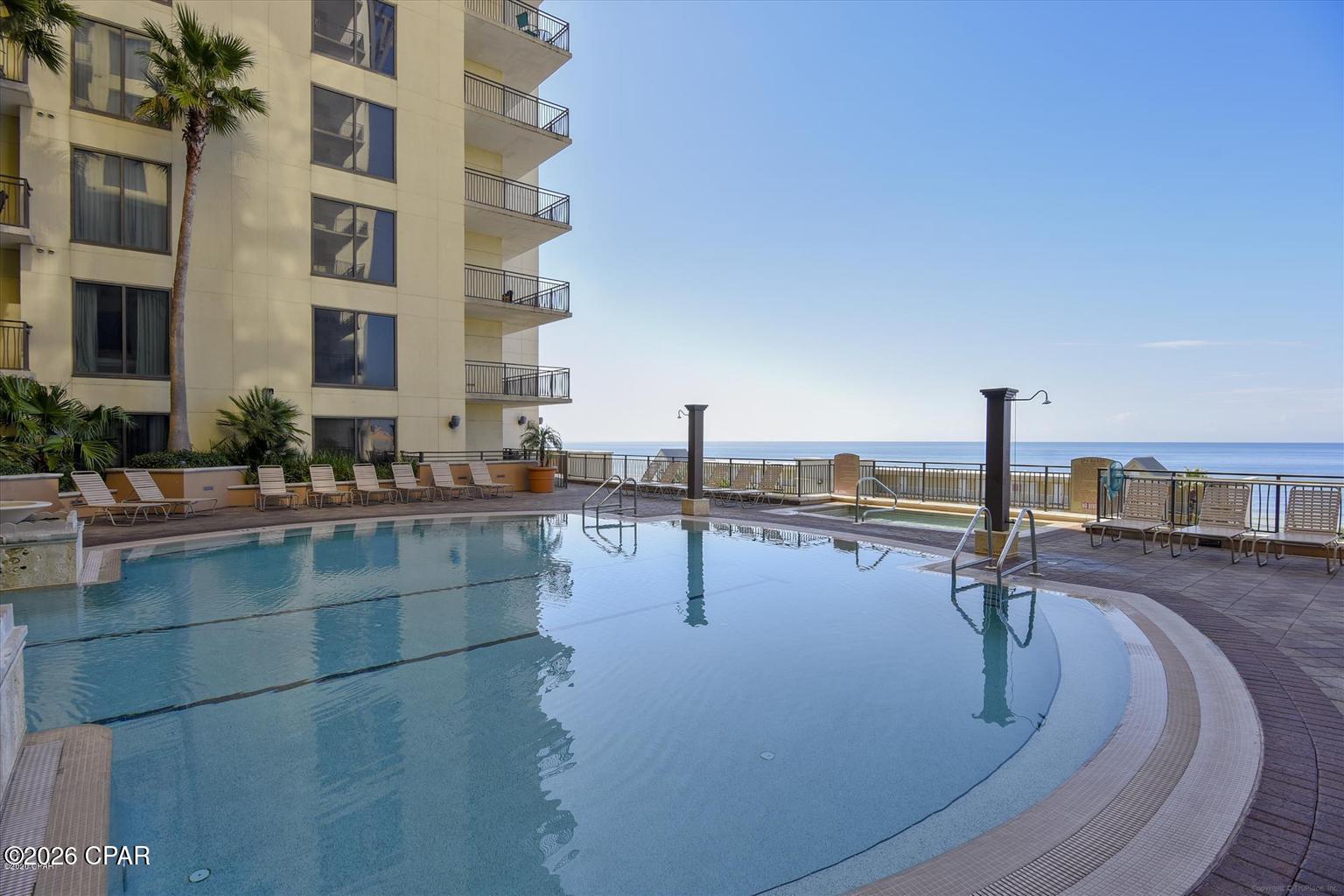COMING SOON - NO SHOWINGS. Rare opportunity to own a desirable 4th-floor pool-level condo at Origin at Seahaven. This spacious 1-bedroom, 1-bath unit offers approximately 815 square feet and features convenient direct access from the rear patio to the resort-style pool deck and amenities. Whether you're looking for a personal beach retreat, second home, or income-producing investment property, this unit's prime location makes it an excellent rental opportunity.

Origin at Seahaven is ideally situated directly across from the Gulf of Mexico and offers an impressive collection of amenities including a heated pool, hot tub, fitness center, game room, owner's lounge, movie theater, covered parking garage, and stunning rooftop observation deck with panoramic Gulf views. Located just minutes from Pier Park, Sharky's Beachfront Restaurant, shopping, dining, entertainment, and some of Panama City Beach's most beautiful beaches. Enjoy the convenience, amenities, and strong rental potential that make Origin at Seahaven one of the area's most sought-after resort communities. Listing Photos Coming Soon!