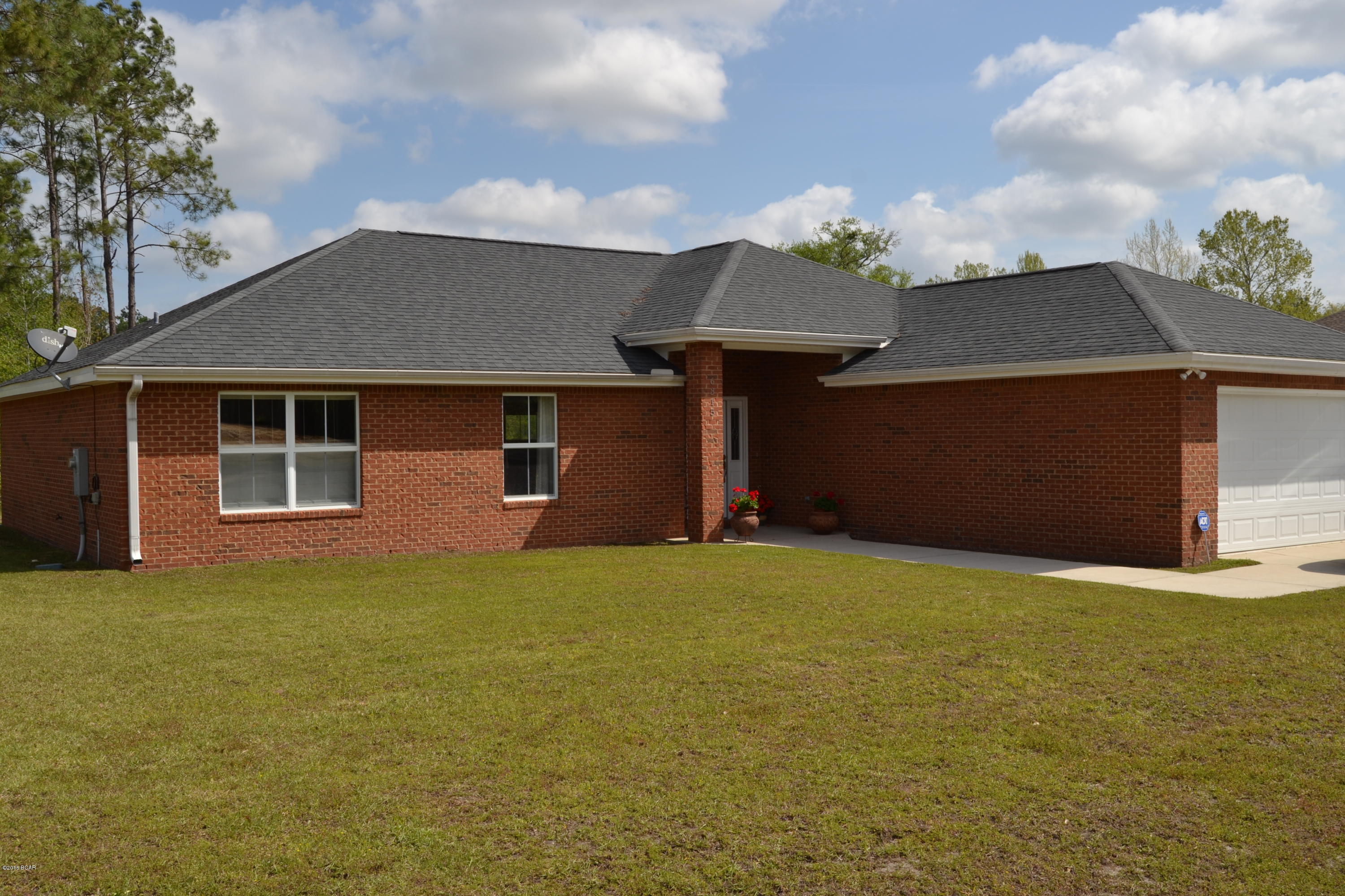 Like new, contemporary style brick home located in a popular and growing neighborhood.  This 4 bedroom, 2 bath home looks and feels like a brand new home yet it is priced thousands below new construction.  The interior of the home has an open concept with a fireplace, built in entertainment center in the living room and custom built hutch in the dining room.  The kitchen has loads of storage space with plenty of cabinets and countertop space plus a separate pantry.  A breakfast bar separates the dining room and living room (vaulted ceiling in living room).  The oversized master bedroom is split from bedrooms 2,3 and 4 and features a luxurious bathroom, complete with double vanities, garden tub, separate shower and huge walk in closet. The remaining 3 bedrooms are very large and accomodating for one to be made into a home office.  The laundry room is perfect for additional storage and has room for a stand up freezer.  The overall condition of the home is just like brand new!!!  The exterior of the home is solid brick construction and features a double driveway leading to the two car garage and a covered back porch overlooking a private lot that can not be built on.   This home is not a drive by!! Call to schedule an appointment today!!!