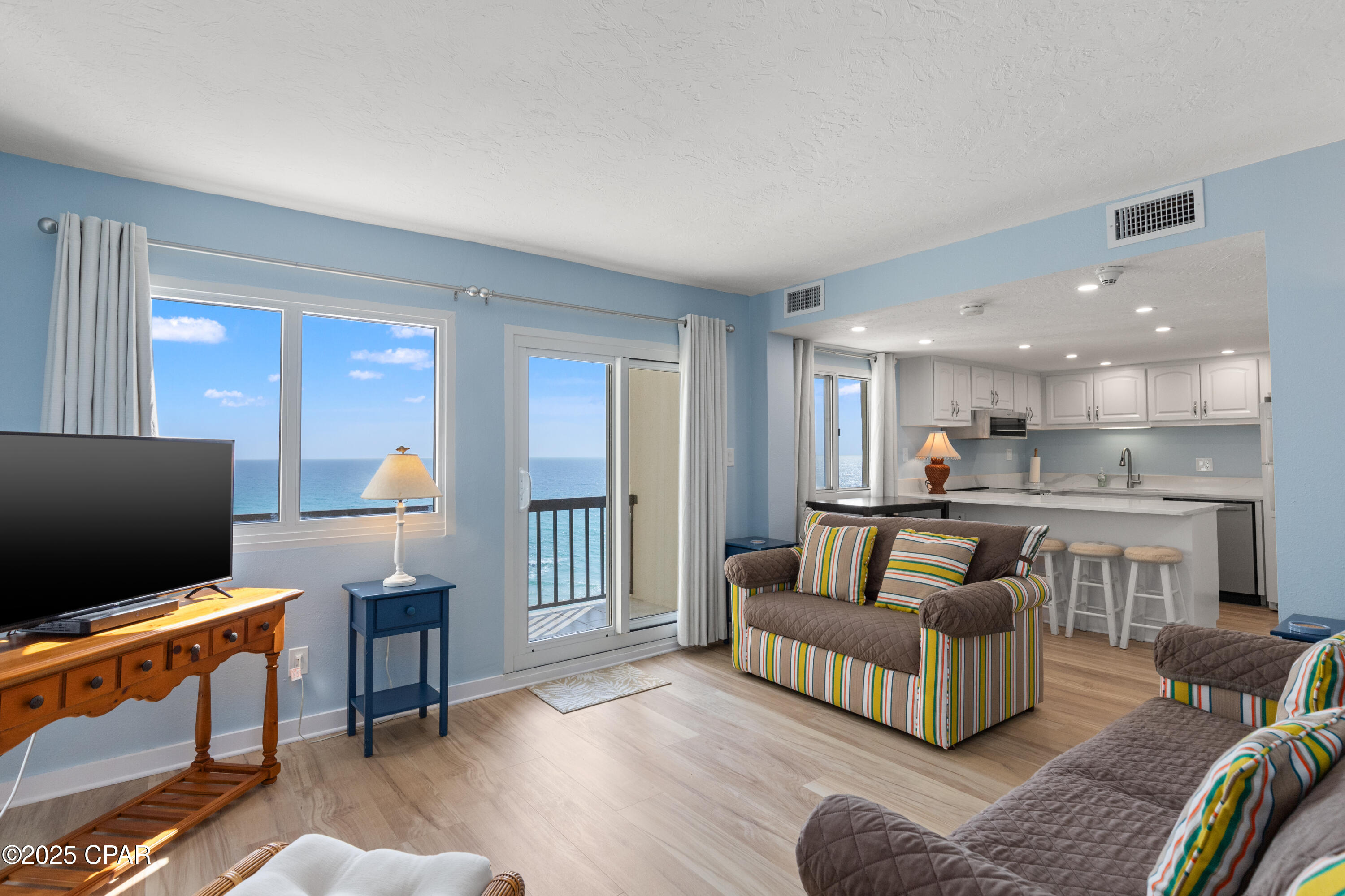 This beautifully remodeled gulf front condo offers the perfect blend of modern luxury and coastal charm. From the moment you step inside, you are greeted by an open-concept living area featuring windows that frame breathtaking views of the Gulf of Mexico and the Tower's indoor/outdoor heated pool.
The kitchen has been updated with appliances, solid-surface countertops, and cabinetry, making it both stylish and functional for cooking and entertaining.  The half-bath laundry features a large stack washer/dryer.  The bathrooms showcase modern fixtures, beautiful tilework, providing a spa-like retreat after a day at the beach.
Luxury vinyl plank flooring runs seamlessly throughout the condo, complementing the crisp, neutral color palette. The master suite boasts direct access to a private balcony overlooking Lake Powell, perfect for enjoying morning coffee or watching the sun go down for the day. 
With direct beach access just steps away, this remodeled gulf front condo is an exceptional opportunity to experience waterfront living at its finest.
Pinnacle Port Resort is situated on a 25+ acre site within a beautiful gated community having over ¼ mile of beach frontage!  The complex has lots of amenities including two swimming pools, tennis courts sauna/steam room, fitness room, its own private freshwater dock with boat slips boat launch and wi-fi.   Please note that the Association fees include electricity for heating, cooling and hot water.  The owner pays a small electricity bill for lighting and appliances only.