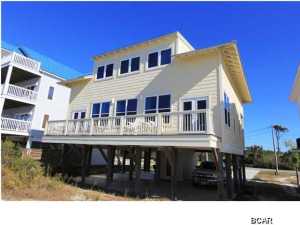Fantastic beach front single family home on the North End of Cape San Blas built in 2012. This home has a great open layout with tons of natural light and has produced almost $50K in rental income in each of it's first 2 years on the rental program despite the owner using it a number of weeks. The first floor above the covered parking features hardwood floors, granite countertops, stainless appliances, and the master bedroom that faces the beach along with a guest bedroom. The entire top floor is a 2nd living room plus bunks which makes a great guest suite or kids floor. There are no hoa fees and this home is not a short sale or foreclosure, but the owner has priced it aggressively and $100K less than any beach front house on the North End of CSB. Seller requires a pre-approval letter