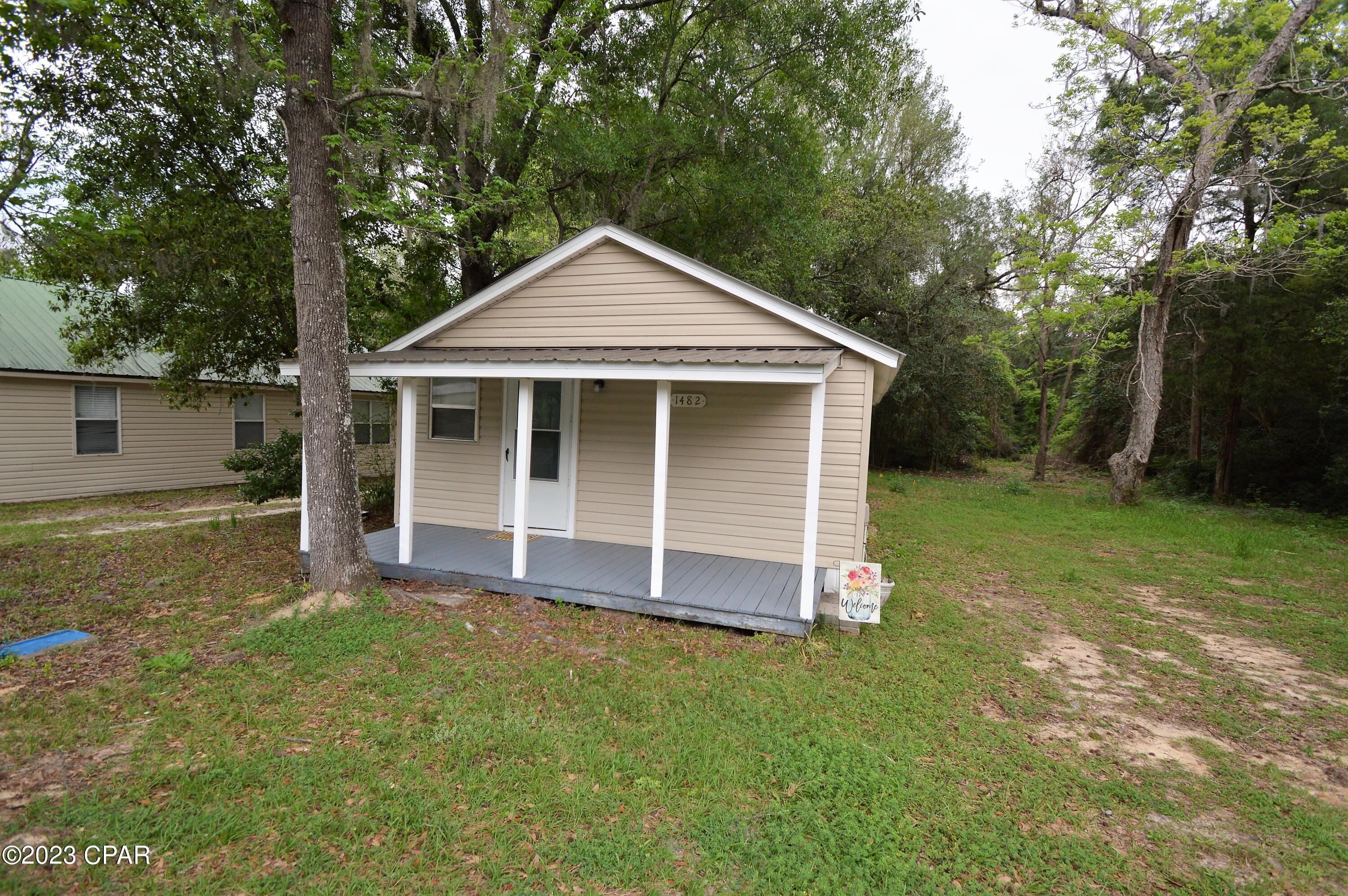 Rare find!  Welcome to this charming two bedroom, one bathroom home in the City of Chipley located on over 3.75 acres! With a modern feel and cozy atmosphere, this quaint property is perfect for those seeking a comfortable living space in a convenient location.  As you step inside, you'll be greeted by the beautiful LVP flooring that flows throughout the entire home. The open concept living area is perfect for entertaining guests or enjoying a quiet night in. The kitchen boasts stunning granite countertops, providing a space that is as functional as it is stylish.  Outside, you'll notice the durability and low maintenance of the metal roof and vinyl siding, giving you peace of mind for years to come. Don't miss out on this opportunity to make this house your new home!