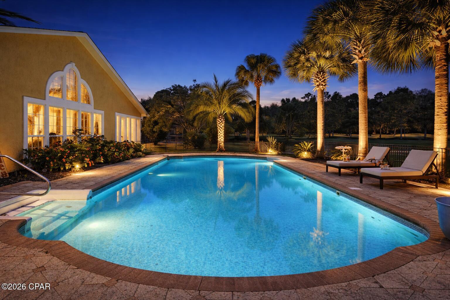 3,200 sq ft golf course pool home with multiple living areas, 2 offices, new HVAC, new water heater, and no HOA near the beach.

3200 sq ft pool home on Legacy Golf Course with multiple living areas, 2 offices, new HVAC system, new water heater, and no HOA, located approximately 1.4 miles from public beach access in Panama City Beach.

Located within the Colony Club community near Legacy Golf Club, this property offers a combination of space, flexibility, and convenience that is increasingly difficult to find this close to the beach. The neighborhood features underground utilities, established homesites, and no HOA dues.

Designed with multiple gathering spaces and flexible-use areas, the home includes a large main living area with vaulted ceilings and arched windows overlooking the pool and golf course, an additional living space centered around the fireplace, a formal dining area, and a built-in sitting nook near the entry that creates a library-style retreat.

The layout supports a variety of lifestyles with two separate office spaces ideal for remote work, hobbies, fitness, or additional functional use. A bonus space originally designed as a bedroom has been converted into a large custom closet with built-in storage, a sink, and a vanity, offering flexibility based on buyer needs.

The kitchen features quartz countertops, ample cabinetry, and a functional layout that connects seamlessly to surrounding living areas for both everyday use and entertaining.

The primary suite is designed for privacy and includes a spacious bedroom, an en-suite bath with a soaking tub and a separate shower, and a walk-in closet. Two additional bedrooms are located on the opposite side of the home.

Recent updates include a brand-new HVAC system and a brand-new water heater, offering added value and peace of mind for the next owner.

Outdoor features include a large private in-ground pool with a safety fence, a covered outdoor living space, upgraded Zoysia grass, an underground irrigation system, a wide driveway, and a two-car garage. The golf course setting offers open rear views and greater spacing between neighboring homes, while a pond across the street enhances the open feel from the front exterior.

Conveniently located near Pier Park, Topgolf, shopping, dining, and Gulf access, this property offers a spacious layout and flexible living environment within an established Panama City Beach golf course community.
