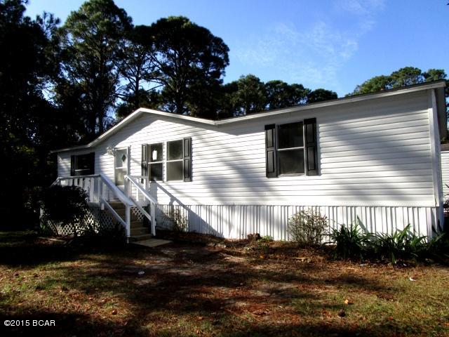 GREAT OPPORTUNITY TO PURCHASE AN AFFORDABLE HOME ON PANAMA CITY BEACH!  This split-bedroom plan home features a spacious living room, eat-in kitchen, a Master bedroom with a walk-in closet and a Master bath with a large vanity and a whirpool tub.  There are two additional bedrooms conveniently located near the full bath, and an additional bedroom/ office has been added to the back of the home and it offers a separate entry.  The home has been freshly painted with new carpeting throughout.  Outside, all new skirting is scheduled to be installed within the next few week.  Located within a mile of Bay Point and its outstanding golf courses, this home is also only a few miles to the beach!
