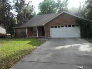REDUCED!!! Three bedroom two bathroom brick vinyl home in Youngstown backing up to a canal offered as is. The canal leads to Deerpoint lake but is not navigable. All sizes approximate please verify accordingly.