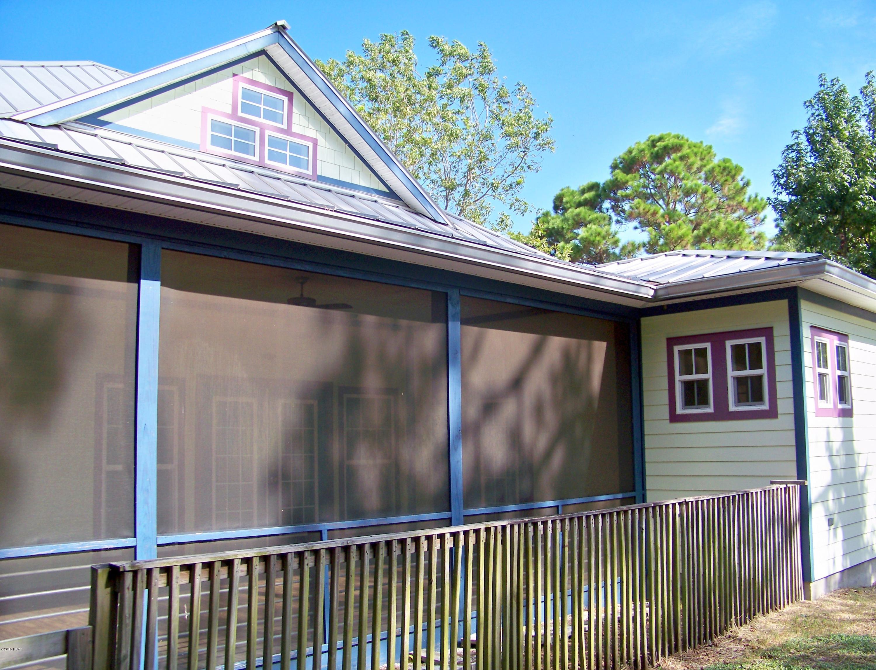 Whether a vacation home or first home, this three bedroom two bath home will soon be at the top of your must see list. Sitting on a quiet, shaded corner lot, you are just a few short blocks to the Gulf. You will enjoy peaceful moments relaxing or entertaining guests on the spacious screened-in porch that wraps around one side of the house. If the location and screened porch were not enough, you will fall in love once you enter the home. The inside is open and airy with stained concrete flooring throughout, gourmet kitchen with top of the line appliances, granite counter tops with plenty of cabinet space and gorgeous vaulted ceiling in the living room. This is a wonderful opportunity you will not want to pass up. Contact your Agent today. This is a Fannie Mae HomePath Property. All measurements, ages, and room sizes are approximate. Please verify if important.