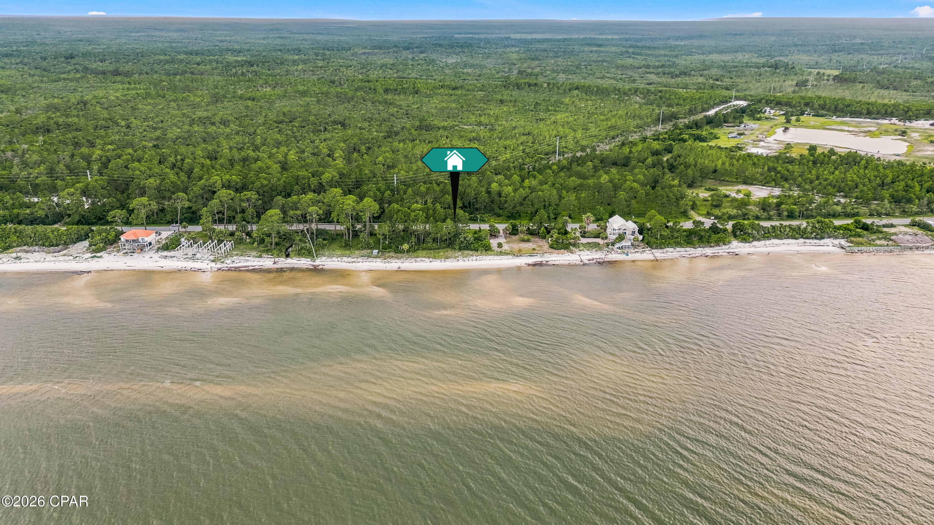 Bayfront vacant land just west of Carrabelle with beautiful frontage on St. George Sound. This coastal parcel offers approx. 100 ft of US-98 frontage and approx. 100 ft of bay frontage, with an estimated size of about 0.28 acres based on survey dimensions. Enjoy wide-open water views, convenient paved road access, and a peaceful setting along Florida's Forgotten Coast. Located between Carrabelle and Eastpoint/Apalachicola, this property offers a rare opportunity to own a bayfront homesite or coastal retreat location. Buyer to verify all information including dimensions, acreage, zoning, buildability, utilities, setbacks, flood zone, permitting requirements, and intended use.