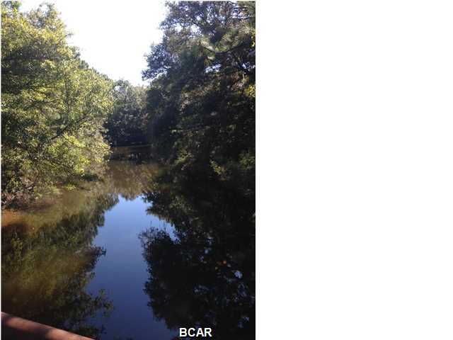 Large corner canal front lot in the desirable King's Point neighborhood. This beautiful lot offers direct access to St. Andrews Bay, the Gulf of Mexico and the Intercoastal waterway. Three lots down at 2337 Foxworth sold for 150K in April 2014! Canal has been dredged and ready for boating, paddle boarding and jet skis. The new University Academy School is open at what was previously the Panama City Airport and development is underway for the remaining acreage. Come look at this beautiful lot today!