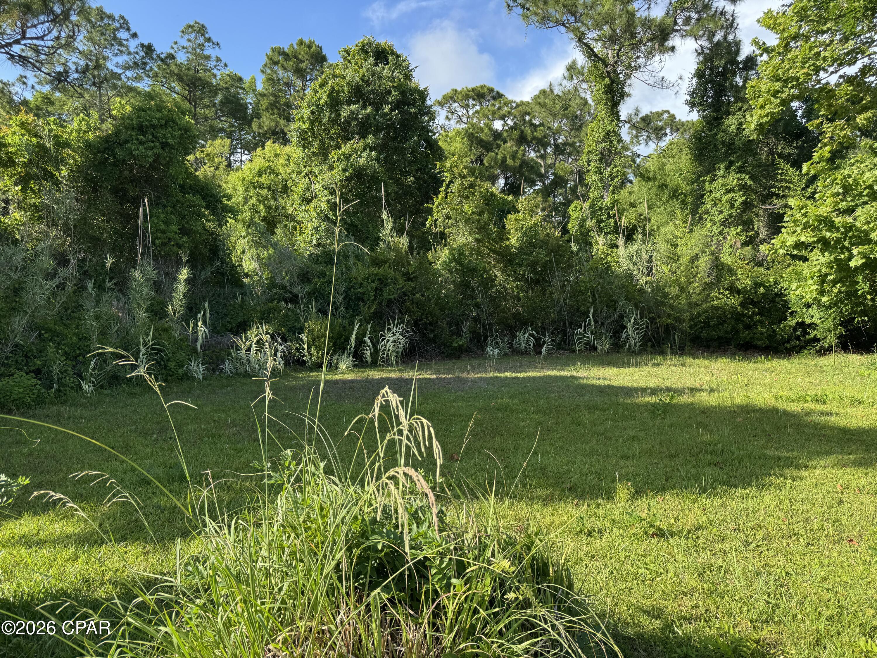 Wow! Waiting for a great piece of property on the West end of desirable PCB to build your dream home or vacation getaway? Check out this spacious vacant lot (.33) acre located at the end of street with no through traffic!  This property provides plenty of space to build your dream home or vacation getaway, all while being conveniently close everything PCB has to offer. And No HOA.  Per Bay County Planning & Zoning Dept; zoned R1. No wetlands.
Just minutes from PIER PARK, you'll enjoy easy access to Shopping, Restaurants, Entertainment, Fishing and the beautiful white sand Beaches! A fantastic opportunity to own property in a prime location near the beach and local attractions!