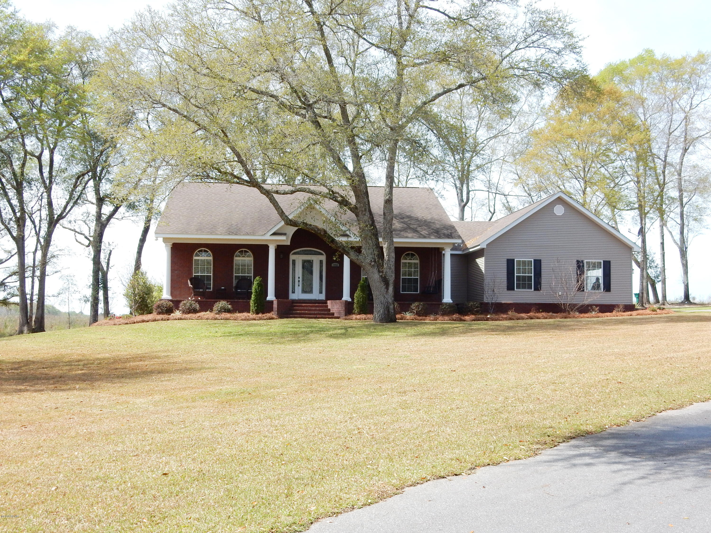 BEATUFUL CUSTOM BUILT HOME LOCATED IN PINEY GROVE ESTATES. THIS 4/2.5 BRICK BEAUTY SITS ON 2 LOTS MEASURING OVER 3.4 ACRES. INSIDE FEATURES INCLUDE AN OPEN CONCEPT WITH SPLIT FLOOR PLAN, FORMAL DINING ROOM, ABUNDANCE OF STOARGE, CROWN MOULDING THROUGHOUT, SPACIOUS LIVINGROOM WITH CATHERDRAL CEILING AND WOOD BURNING FIREPLACE. KITCHEN HAS STAINLESS STEEL APPLIANCES, BREAKFAST BAR, GRANITE COUNTERTOPS AND LARGE PANTRY. MASTERSUITE INCLUDES, NEWLY RENOVATED WALK-IN SHOWER, DOUBLE VANITY AND AN OVERSIZE WALK-IN CLOSET. OWNERS SPARED NO EXPENSE ON THE OUTSIDE INSTALLING A NEW WELL, IRRIGATION, LANDSCAPING, AND AN ASPHAULT DRIVE. THIS IS A MUST SEE.