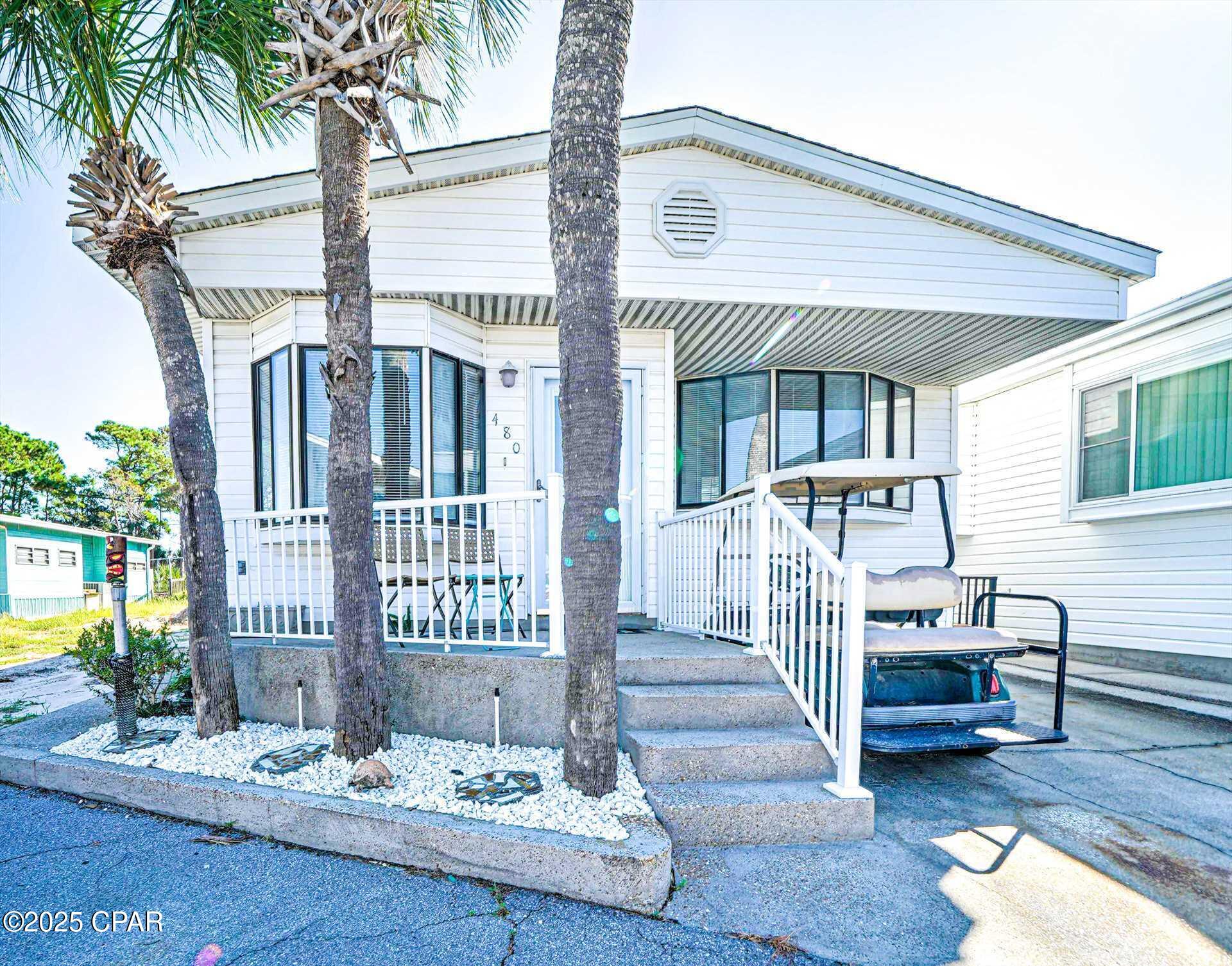 Rare find! State Park paradise views in your backyard. Check out this 2-bedroom, 2 bath beauty! Home has as a great open floor plan and large rooms. The seller has just replaced the roof and has added new gutters!!   Location within in the resort is highly desirable and this home has common ground in the backyard giving you that extra outdoor space you are looking for. Porch could be enclosed and turned into a potential great 3rd bedroom.   Perfect for second home or investment opportunity! Venture Out is a golf cart community that has exploded with popularity recently. With 300' on the beautiful pristine beaches of the Gulf of Mexico and 1,000' on the Gulf!