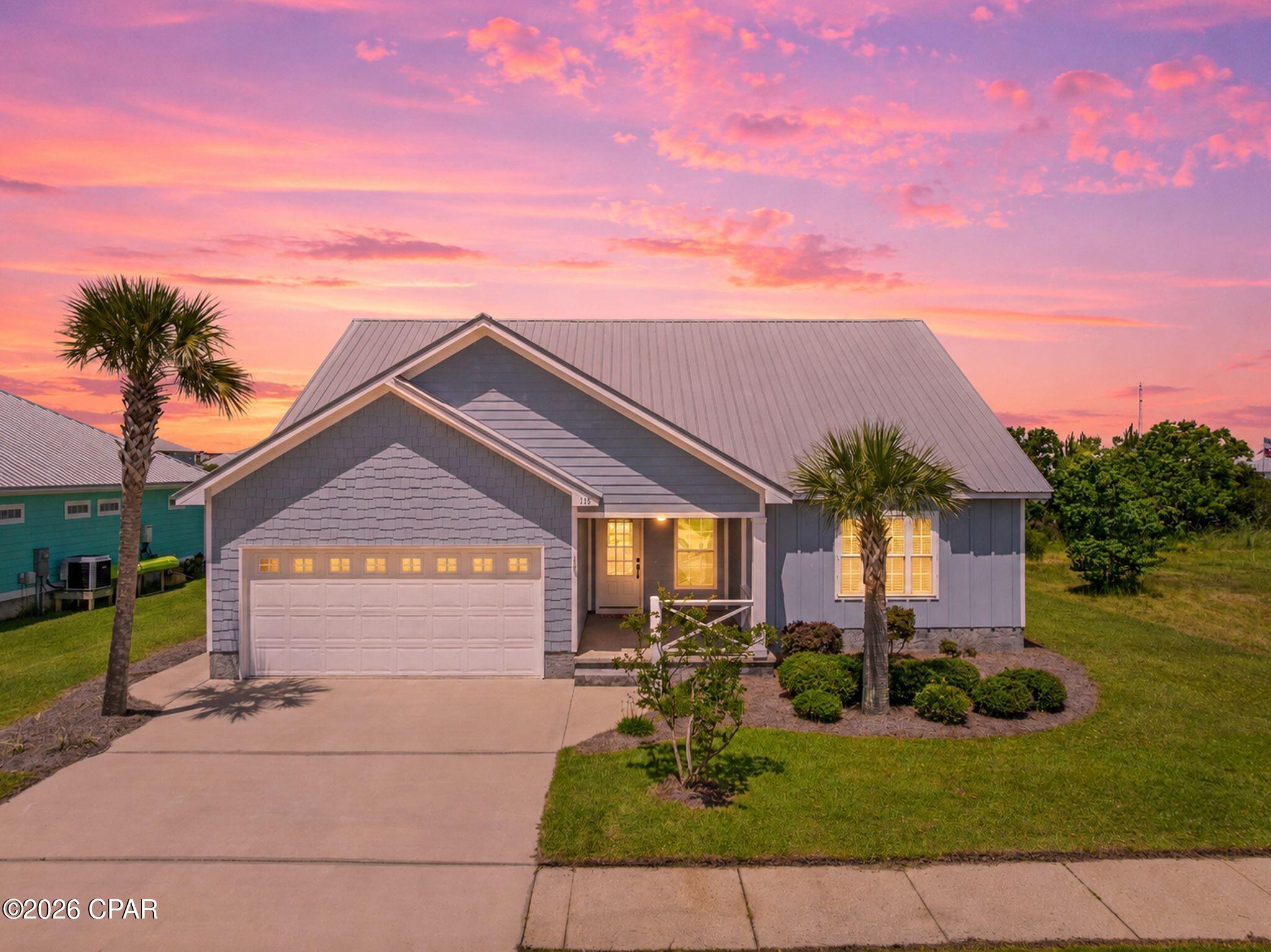 Welcome to Casuna, one of Mexico Beach's most desirable communities, where coastal living meets modern comfort. This beautifully maintained 4-bedroom, 2-bath home offers a spacious open-concept floor plan, quality finishes, and a location just minutes from the Gulf of Mexico. Step inside to discover bright, inviting living spaces designed for both everyday living and entertaining. The open living room flows seamlessly into the kitchen and dining area, creating the perfect gathering space for family and guests. The kitchen features stainless steel appliances, extensive cabinetry, ample counter space, and a bright breakfast nook surrounded by windows. Whether you're preparing a quick meal or hosting a holiday gathering, this kitchen offers both functionality and style. The private primary suite serves as a true retreat, highlighted by a stunning custom-tiled walk-in shower with frameless glass enclosure, built-in bench seating, and designer finishes. Three additional bedrooms provide plenty of space for family, guests, a home office, or hobby space. Additional features include wood-look tile flooring throughout the main living areas, recessed lighting, neutral coastal colors, an attached two-car garage, covered front porch, and move-in-ready condition. Located in the highly sought-after Casuna subdivision, residents enjoy a peaceful neighborhood setting with restrictions on short-term rentals, helping preserve the community's residential character while still allowing long-term rental opportunities. You'll remain just minutes from Mexico Beach's sugar-white beaches, boating, fishing, dining, and shopping while enjoying the benefits of a well-maintained coastal neighborhood. Whether you're searching for a primary residence, or second home this spacious coastal home offers the perfect combination of comfort, convenience, and location. Some photos are virtually staged.