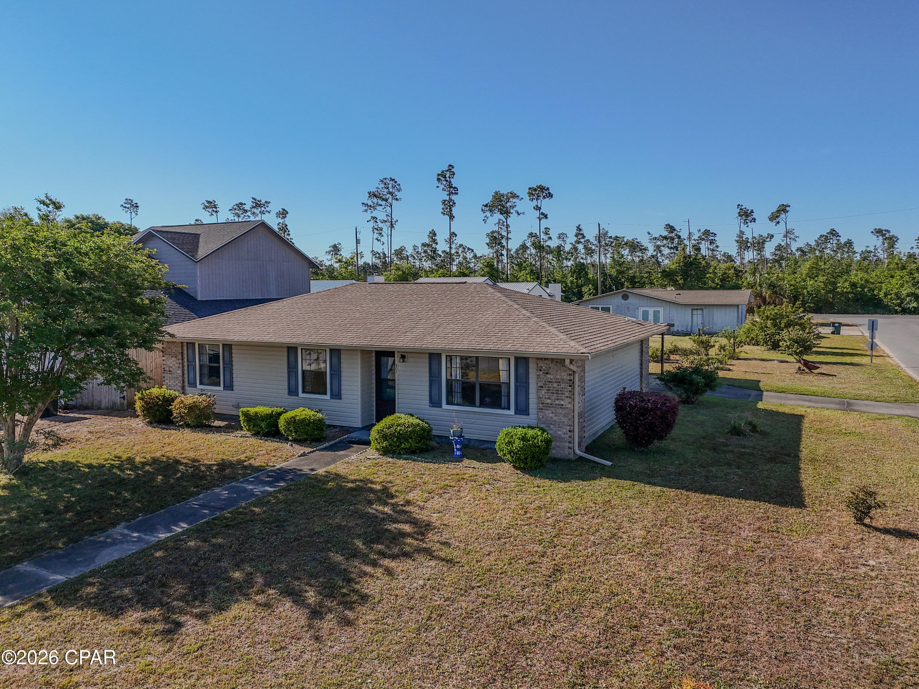 OPEN HOUSE SATURDAY MAY 30TH 12-2PM Welcome to 501 Carrie Lane, a 3-bedroom, 2-bath home for sale in Panama City, FL 32444, offering durability, functionality, and outstanding potential in a quiet, established neighborhood. Situated on a desirable corner lot, this Panama City home features a solid brick and vinyl exterior, providing both low-maintenance living and long-term value.

Inside, the home offers a well-designed layout with comfortable living spaces and an inviting flow, creating an excellent foundation for a buyer to personalize and make their own. This property presents a great opportunity for those seeking a starter home in Panama City FL or an investment property with value-add potential, allowing updates to be completed over time while enjoying the home as it is.

Major system updates have already been completed, including a roof replaced in December 2018, a Rheem HVAC system installed in 2023, and a Rheem water heater installed in 2022, giving buyers added confidence and peace of mind.

The exterior features enhance both functionality and flexibility, including a 17.5' x 18' attached carport that provides two covered parking spaces along with additional driveway parking. The carport extends to the rear of the home, creating an approximately 8' x 18' covered patio, perfect for outdoor relaxation or entertaining. An attached storage room measuring approximately 11' x 3.5' offers convenient space for tools, equipment, or seasonal storage.

Located in Panama City, Florida, this home offers easy access to Tyndall Air Force Base, local schools, shopping, dining, and downtown Panama City, with Panama City Beach and the Gulf of Mexico just a short drive away. Homes in this area are especially appealing for long-term rental opportunities, making this a strong option for investors.

Whether you are searching for a home for sale in Panama City FL, a primary residence, or an investment opportunity, 501 Carrie Lane presents a compelling opportunity to own a well-built home with the ability to enhance and add value over time.