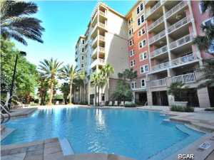 Spacious luxury 3Br-3Ba 4th floor Bay Point Grand Residences End Unit with views of the Golf Course, Grand Lagoon, Gulf and main shipping channel. Features High ceilings, crown molding, open kitchen. living and dinning area. Wrap around porch, very large separate storage area that is heated & cooled. Great entertaining ground level heated pool area with fitness room, pool table, outdoor kitchen, fireplace, fire pit and hot tub. Bay Point offers 24hr security, two 18 hole golf courses, large full service marina along with tennis and children's playground.