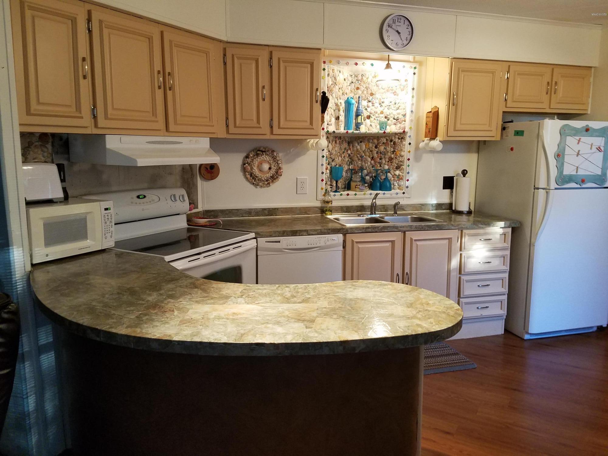 FURNISHED! There is a 3rd bedroom added on to this mobile home with a separate entrance. Full size washer and dryer included. Screened porch, large lot, non HOA. Store your boat or RV. Fenced lot