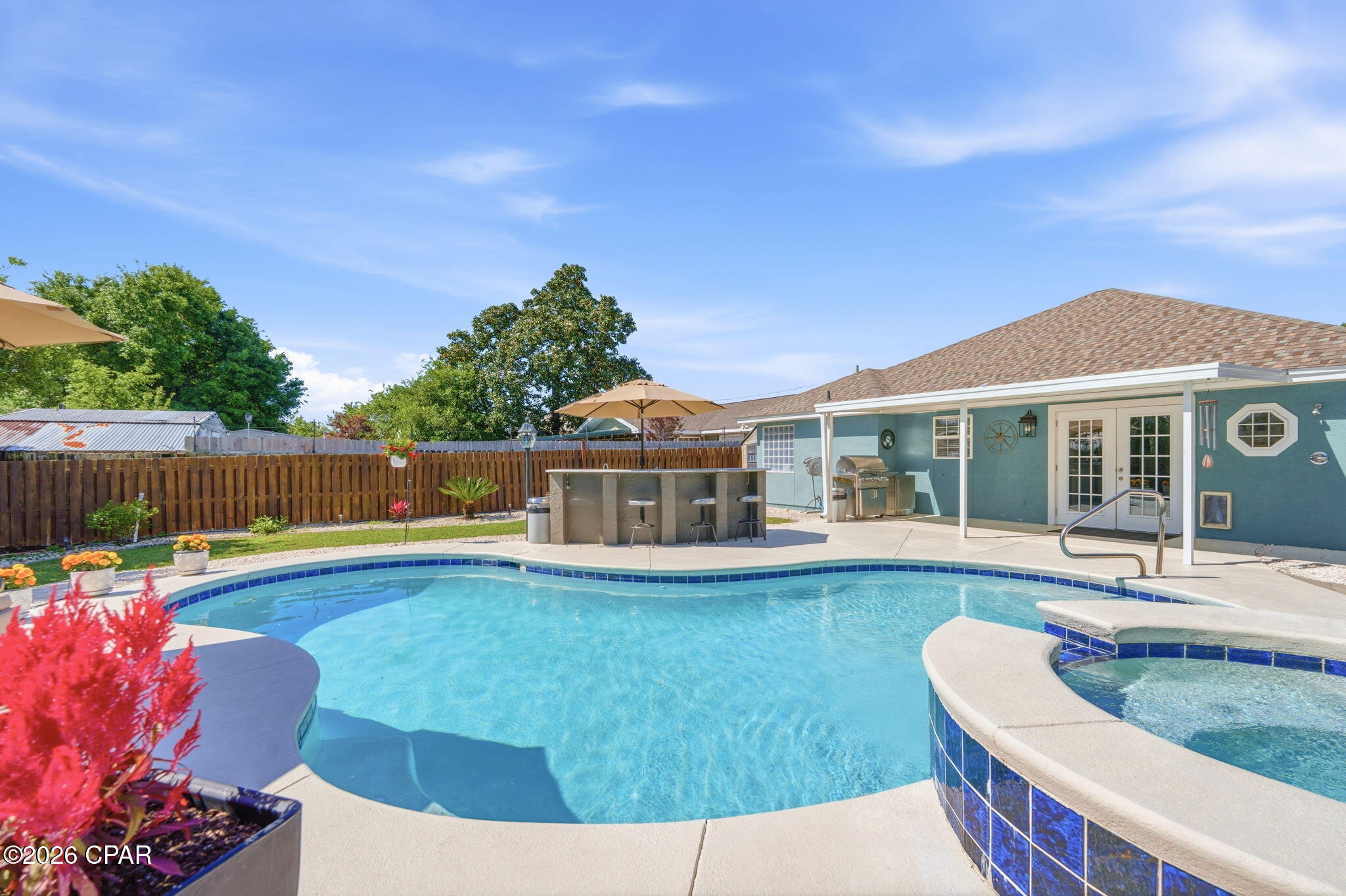 This PRISTINE executive style Beach House is located less than a ½ mile, or in easier terms just a 10 minute
walk to the beach. Offering the perfect blend of luxury, comfort, and outdoor living, it has been completely remodeled from top to bottom with no expenses spared. Boasting high-end finishes
throughout, you will notice as you walk inside, a spacious living area, with 10-foot ceilings and elegant crown molding instantly giving you that roomy fresh air feeling. The kitchen is Just Beautiful:
with granite countertops, and granite back splashes, and all new Premium GE appliances. The master bedroom is a true retreat, featuring both tray ceilings, a large walk-in closet. The spa-like
master bathroom includes garden tub and a walk-in shower with a luxurious rain head. Step outside and experience what truly sets this home apart. The backyard is an entertainer's dream, showcasing
a gorgeous, lighted pool with a tranquil water feature as the spa spills into the pool. Complete with natural gas, the spa and pool can be heated for your pleasure, and is much less expensive than propane, or electric units. The pool and spa are both digitally controlled by waterway oasis technology, and can be easily programed without, stepping outside. The Fire Magic grill is included, and it's also on natural gas, so you will never need to refill that propane tank again. Perfect for hosting gatherings year-round, you will find an outdoor bar with granite countertops, and seating to accommodate your guests. And to top it off, there is even a heated outdoor shower. The landscaped yard is enhanced by a 24-volt lighting system that beautifully illuminates the trees and planters at night. An automatic sprinkler system will help keep everything lush and easy to maintain. This place has all the bells and whistles, and is ready for you to step and call it home.