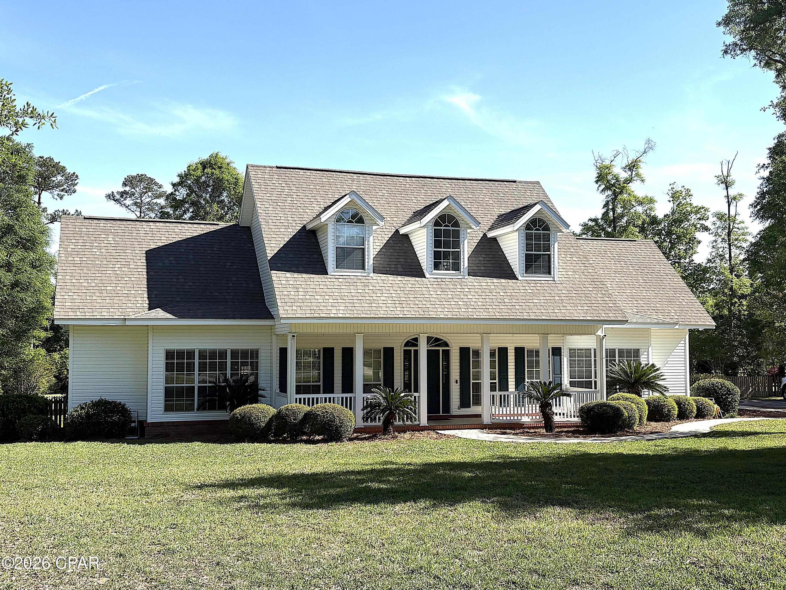 Located on the Magnolia Oaks Golf Course 12th hole and fairway is this 3BR/3.5 bath home. The home features a large living room with vaulted ceilings, a wood-burning fireplace, NEW laminate hardwood floors, 2 French doors accessing the rear deck overlooking the back yard, salt water pool and the golf course There is a formal dining area along w/ a separate breakfast room. The beautiful laminate wood floors are throughout the living spaces & master bedroom. The kitchen was updated (2017) with new quartz counter tops & new tile back splash. The spacious master bedroom has a sitting area & large master bathroom with a whirlpool tub, separate shower, double vanity, & a large walk-in closet. Both bedrooms upstairs have REAL dormers, 2 closets &  each has their own private bathrooms.  The guinite, salt water pool was installed in 2020 and over looking the pool is the rear deck and the POOL HOUSE/ Guest Suite that has 696 +/- sq ft, 2 bedrooms, 1 full bath, kitchenette and open space all heated and cooled by a mini split unit.  Recently replace the 2 electric hot water heaters. Seller has signed up for and paid for the hook up of public water and sewer once available and coming soon.
*** Pool house square footage is included in the total sq ft, bedrooms and baths are not listed in totals