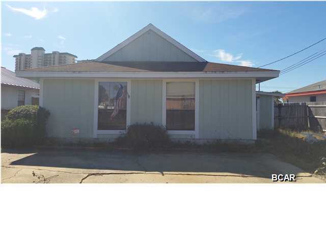 PRICE REDUCED DOWN 25,000! Welcome To The Worlds Most Beautiful Beaches! Motivated Seller, bring your offer! This home is a 2 bedroom 1 and a half bath in need of some work. Custom built solid oak cabinets in kitchen. Screened in porch and sliding glass doors that lead to a covered patio and completely fenced in back yard. This home would make a great vacation home, investment property or starter home. This home is in a great location and is walking distance to the beach. PLEASE DO NOT MISS OUT ON THIS GREAT PRICE! Come and enjoy beach life for less!