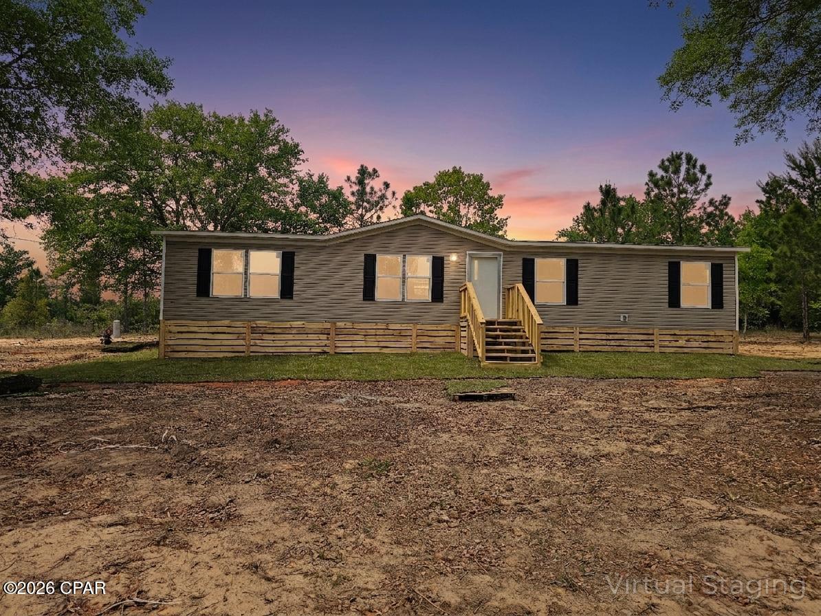 Brand-new 2026 '' The OAK'' manufactured double-wide home in Compass Lake in the Hills on one acre.This 1475 square foot residence offers a bright, modern layout with four bedrooms and two baths, designed for comfort and efficiency. This home is conveniently located about 30 minutes from Panama City. Contact your agent for more information. 
All measurements to be verified by buyer.