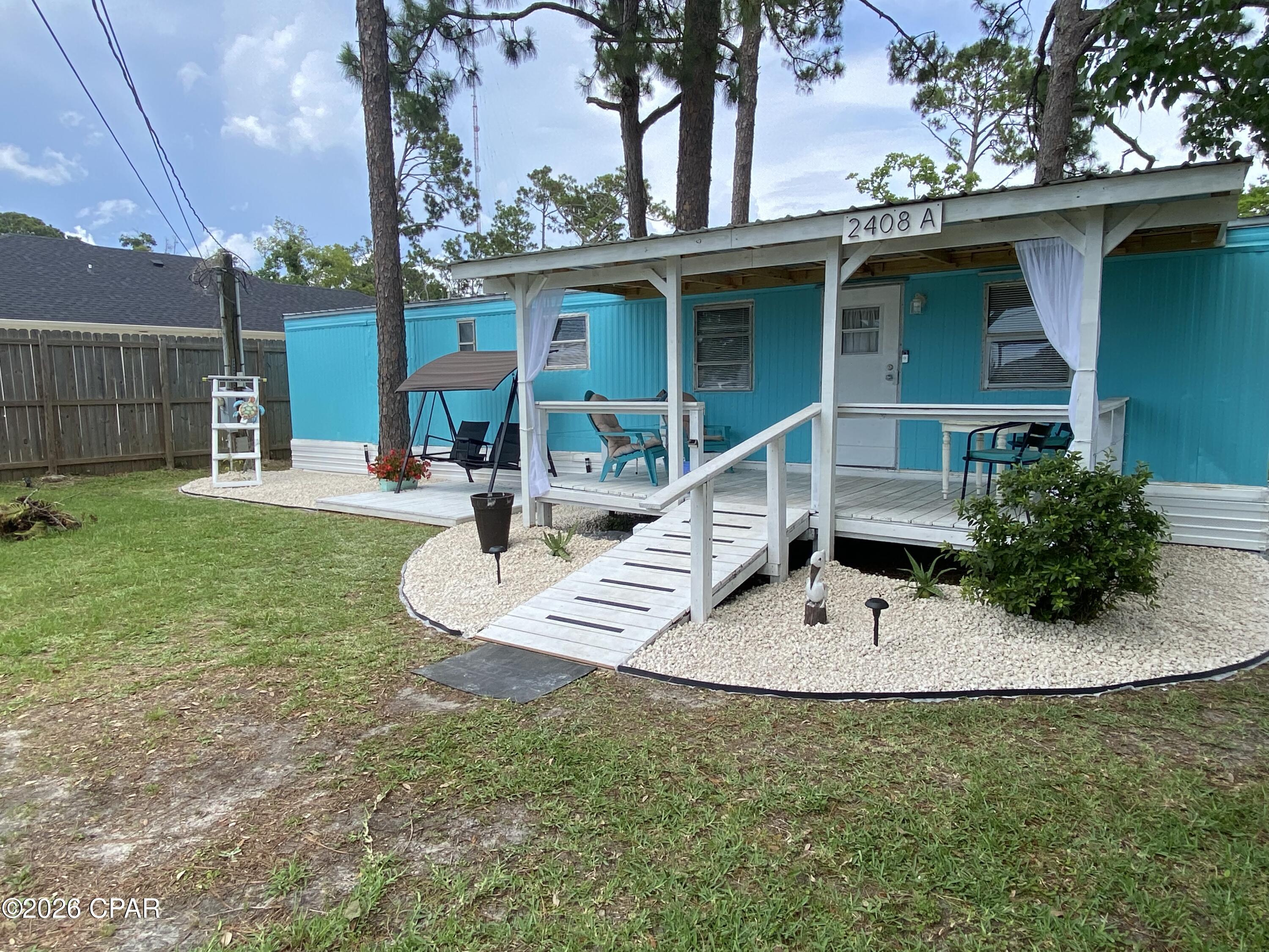 Zoned R-2 (BC) This property holds so much potential.  Cute little mobile home holds a little charm quintessential of Key West style. Property includes a storage unit in the backyard. A large deck on the front of the home. Could be a great rental property long term or short term.  Or maybe you might want to build two townhomes or a duplex and live in one while you rent out the other.

There are 3 adjacent parcels that are listed for sale as well by a separate owner.  Total of .64 acres available for purchase to potentially build 4 sets of townhomes or duplexes.