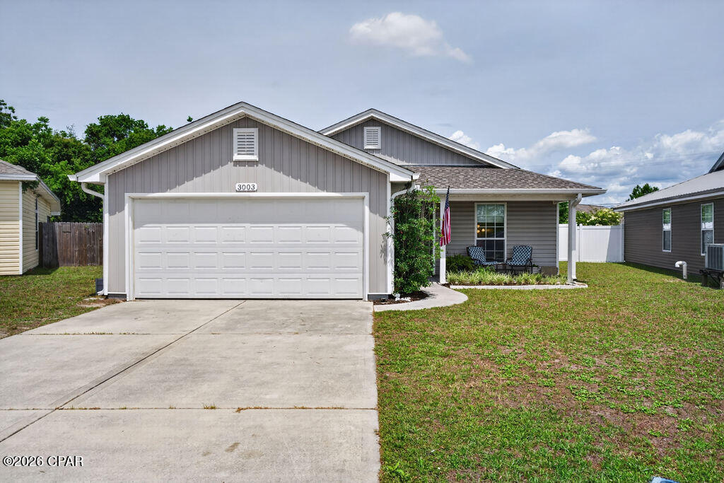 Charming 3-bedroom, 2-bath home conveniently located less than 25 minutes from Tyndall AFB, St. Andrews Marina, and downtown Panama City for dining, nightlife, and waterfront fun. Inside, an open floor plan  with wood look tile, creates seamless flow between living, dining, and kitchen areas, while large bedrooms offer comfortable private spaces for family, guests, or a home office. The kitchen features plenty of counterspace, a breakfast bar, and a pantry giving the family chef plenty of space to work. The master suite is a true retreat with a generous bedroom, and an ensuite featuring a large vanity, a walk-in shower, and a roomy walk-in closet. Outdoor living is exceptional with a huge covered patio that provides shaded, weather-protected space for lounging or entertaining year-round, plus an additional open patio ideal for grilling and casual cookouts. The large vinyl privacy-fenced backyard offers ample room for a pool, workshop, garden, play area, or whatever you envision, and the covered front porch adds curb appeal and a welcoming spot for morning coffee or evening conversations. Schedule a showing to see how this home blends comfortable indoor living with outstanding outdoor potential.