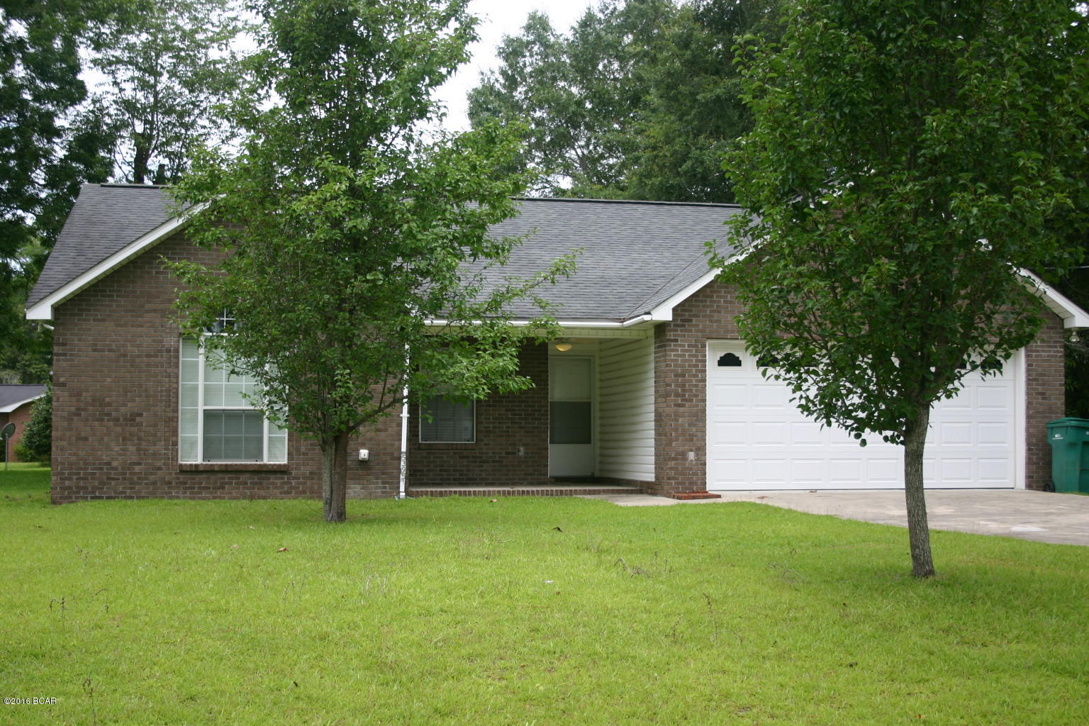 Move in ready, affordable, perfect home! This is the one you have been waiting to come on the market! Newly built in 2005...Located in a quiet neighborhood and surrounded by well kept homes. It's a beautiful brick and vinyl home on a city lot that feels like a lot of yard but with little upkeep. Split bedroom floor plan with an eat-in bar, walk-in closet in the master bedroom, 2 car garage. All floors are vinyl for easy care, and relief for allergy sufferers. Neat, clean, ready for you to buy! Call to see today. Located in the quaint city of Graceville, Florida which is the home of the Baptist College.
