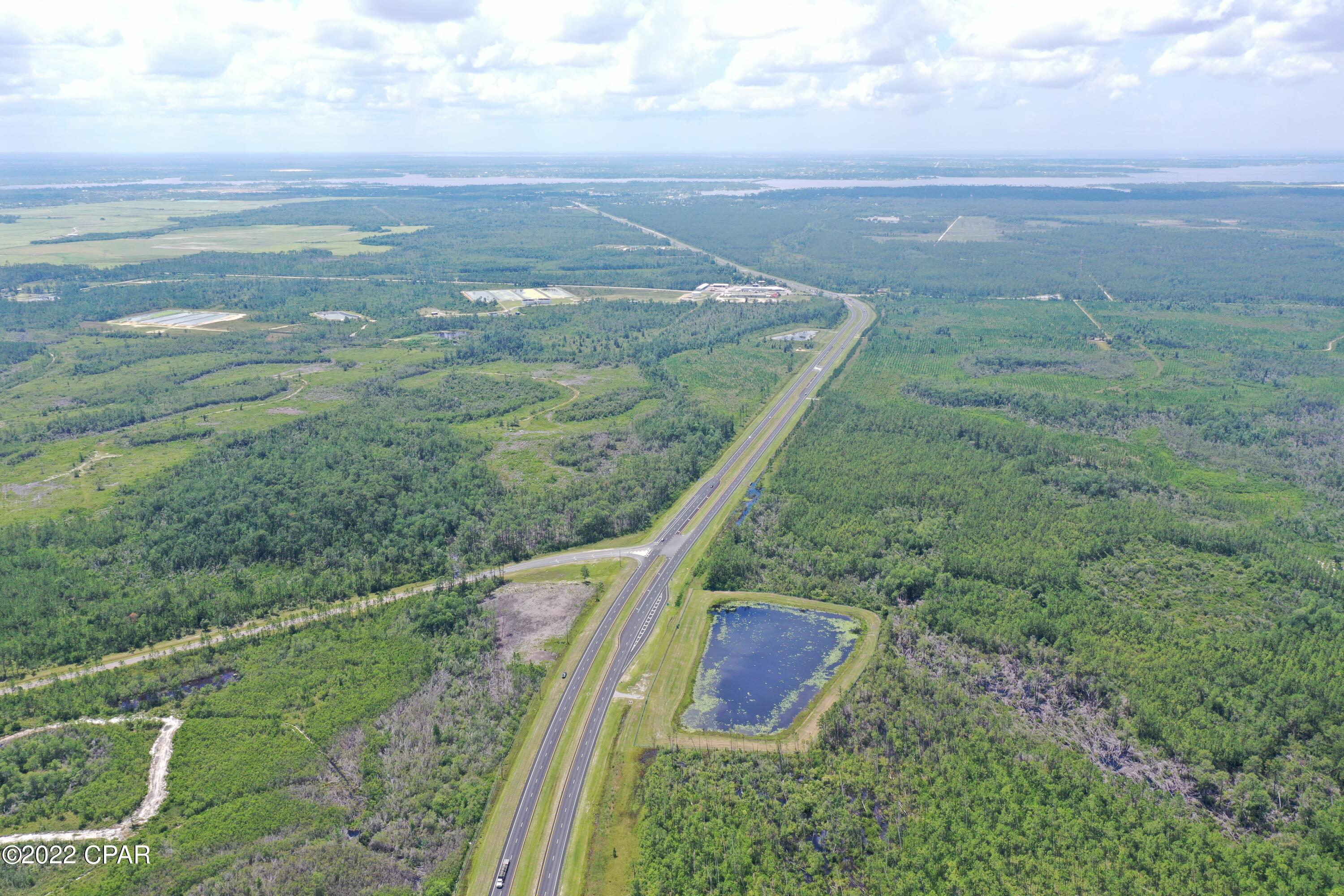 Best commercial corner in North Bay County, 4.5 acres at the intersection of Highway 77 and East Highway 388. 640 feet on Highway 77, 604 feet on Highway 388.  Water and sewer are at site and the C-3 General commercial zoning allows for all commercial uses.  The future West Bay Parkway will also intersect with this property in the future.  Be the first to own the best commercial corner North of Lynn Haven!