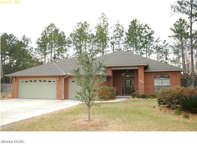 Gorgeous 2003 Parade Home awaits you in this popular Lynn Haven subdivision. All the extras you want in your executive home: lots of deep crown & chair moulding, deep baseboards & door trim, bull-nose corners, hardwood floors,lge ceramic tile, arch accents & columns throughout. The formal dining area has all of these, plus a tray ceiling, making it an elegant dinner setting. Enter the lge formal living rm/study/den through french doors w/an etched glass transom. The window in this room is treated with magnificent plantation shutters. In the family room you'll find a FP surrounded by a built-in entertainment center complete with bookshelves, cabinets for storage & wired for surround sound, featuring iLan, a centralized network for communications & entertainment. Open to the family rm & breakfast nook is the gourmet kitchen. Plentiful alderwood kit cabinets w/special lighting, corian counters, ceramic stovetop, pantry & breakfast bar make you want to become a chef, if you aren't already! The Master Suite is a true retreat w/the same incredible plantation shutters as the den. Walking into the MBA you'll feel like you are in an exclusive spa with its columned arches around the huge whirlpool tub, decorative tile, gorgeous cabinets w/raised sinks & 10' tiled walk-in shower w/rainfall shower head. Walk through the french door to the back patio & you have another huge area in which to entertain w/the screened pool. The pool is a specially designed ''sports'' pool, perfect for playing volleyball, but turn on the fountains & waterfall & you have the perfect backdrop for an elegant soiree. There is also a hottub & in the private backyard, a firepit for those crisp Fall nights. This home has a 3 car garage w/tons of storage. A great neighborhood in an excellent school district, this is an absolute MUST SEE!