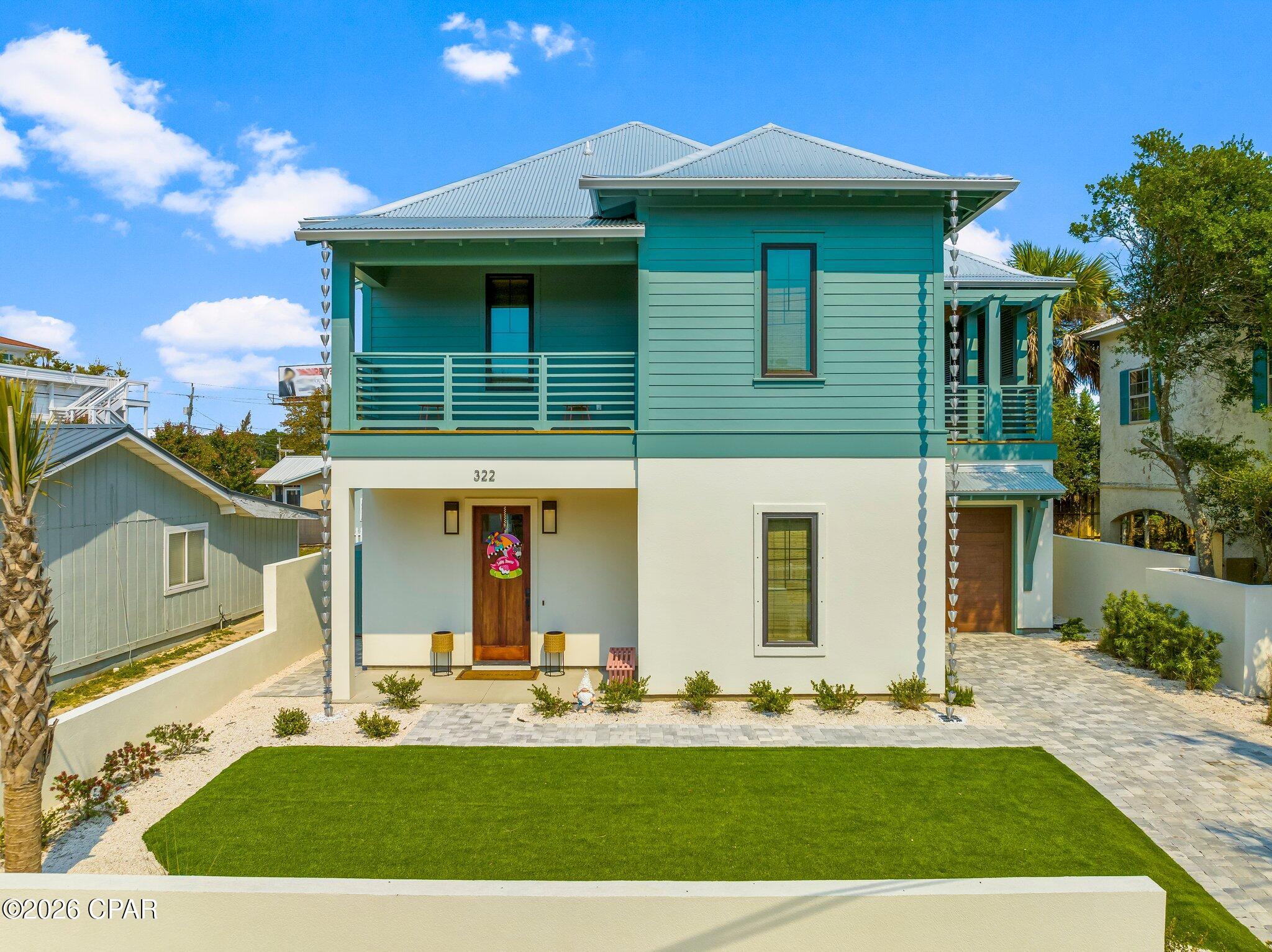 Welcome to your turnkey coastal haven at 322 Sea Breeze Drive, a stunning Rosemary Beach-inspired retreat nestled in the rapidly emerging west end of Panama City Beach, just moments from beach access. Whether you're seeking a premier short-term rental investment or your ultimate dream vacation escape, this property delivers on every level. Currently enrolled in a rental program with $47k already on the books and projected to generate nearly $80k this year, the income potential here is truly impressive.
Step outside into your own private oasis, where an oversized veranda, fully equipped outdoor kitchen, and resort-style saltwater pool with waterfall feature and sun ledge create the ultimate setting for entertaining and unwinding. A whole-home generator ensures true peace of mind year-round.
Inside, the designer finishes are nothing short of extraordinary. The light-filled living room showcases a dramatic coffered ceiling and sleek linear electric fireplace, while the chef's kitchen dazzles with quartz countertops, custom cabinetry, an apron sink, a striking accent island, designer lighting, and a bold statement backsplash. A floating staircase with cable railings adds breathtaking architectural flair from the moment you arrive.
The thoughtfully designed split floor plan offers two primary suites, one on the main level and one upstairs, providing privacy and comfort for every guest. The upper level also features a welcoming loft, a fun bunk bedroom with full-size bunks, and an additional guest room with a queen bed, all sharing a convenient Jack-and-Jill bath. Just off the loft, a charming shaded porch with shutters offers the perfect nook to curl up with a book or decompress after a sun-filled day at the beach.
Modern craftsmanship, coastal allure, and effortless luxury, all in one address.
