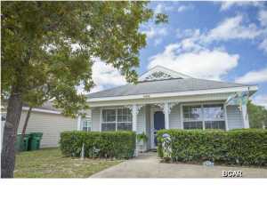 Price just reduced by $5,400!!! Life doesn't get anymore cozy than living in the quiet waterfront community of Lighthouse Point. This family friendly subdivision features access to the water, public boat dock, community picnic area, and a playground where children can play (see photos). This must see 3 bedroom 2 bath home contains 1,188 square feet, and is move in ready for your buyer. Home comes partially furnished. Furnishings include two fully furnished spare bedrooms, window treatments throughout the home, metal outdoor furniture on patio, and wooden furniture outside of screened in patio. The private fenced in back yard also features a storage building, where you'll find a gas grill, charcoal grill, electric lawnmower, and beach supplies that stay with house. Living here,