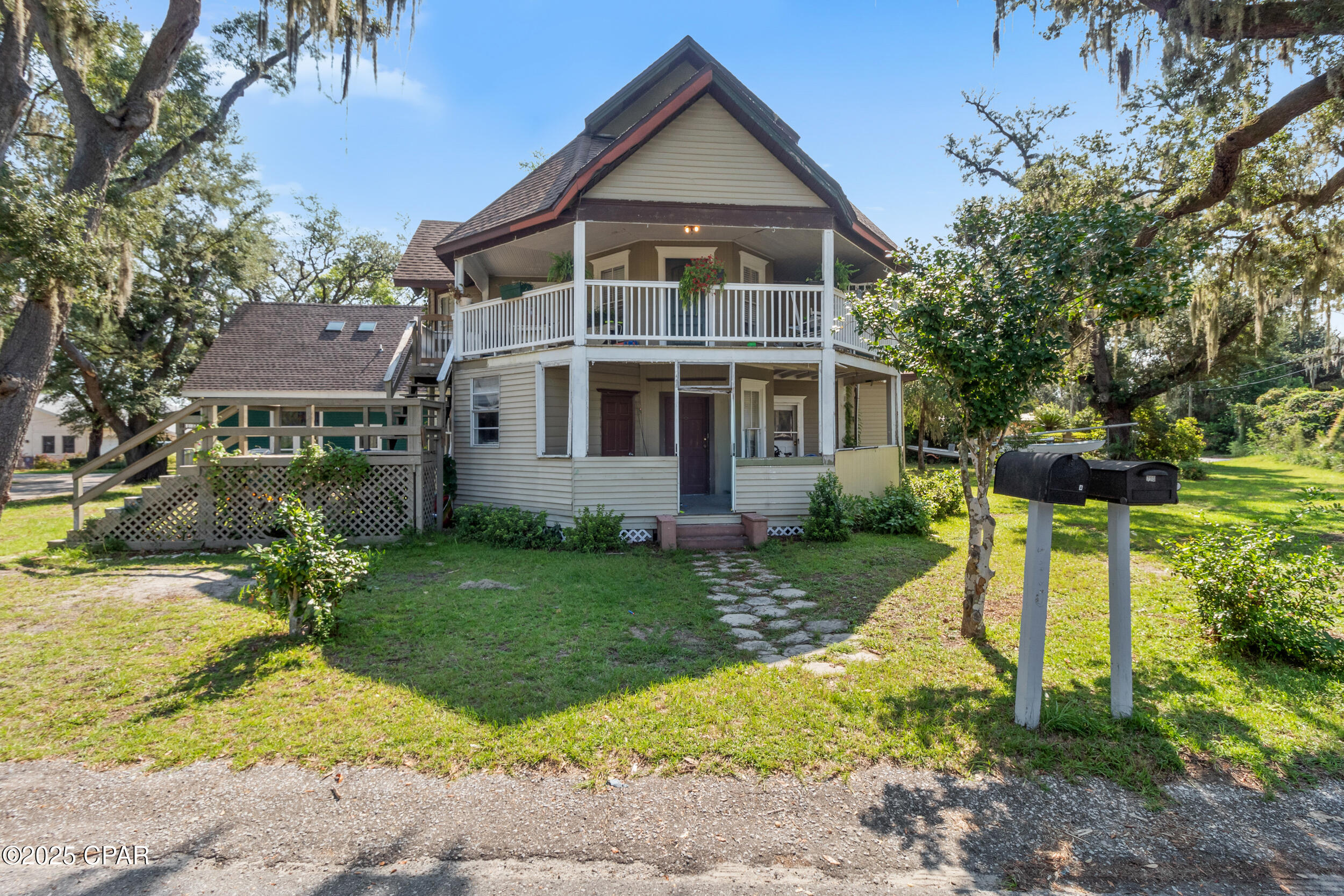 Rare Land Opportunity with immediate Income-Producing Carriage House in Beach Drive

Positioned on an expansive quarter-acre corner lot in the highly sought-after Beach Drive area, 710 Moore Circle presents a unique opportunity to secure valuable land in one of Panama City's most desirable locations. Just a short walk to St. Andrews Bay, this property offers the ideal setting to build, expand, or reimagine.

The primary value lies in the land and its potential. The existing main residence is in need of a full renovation or possible redevelopment, allowing the next owner to design and create something truly special that maximizes the homesite and water view potential from a future build.

Adding immediate upside, the property includes a charming two-bedroom carriage house that is already livable and well-suited for rental income, guest accommodations, or a temporary residence while building. Featuring wood flooring, an updated kitchen, inviting living space, and unique architectural details like skylights and a private balcony, this secondary structure blends character with functionality.

Surrounded by mature live oaks and located within walking distance to downtown coffee shops, restaurants, breweries, parks, and the farmers market, this homesite offers both lifestyle and long-term value. 

Whether you're an investor, builder, or visionary buyer, this is a rare chance to secure land in a premier location with built-in income potential and endless possibilities.