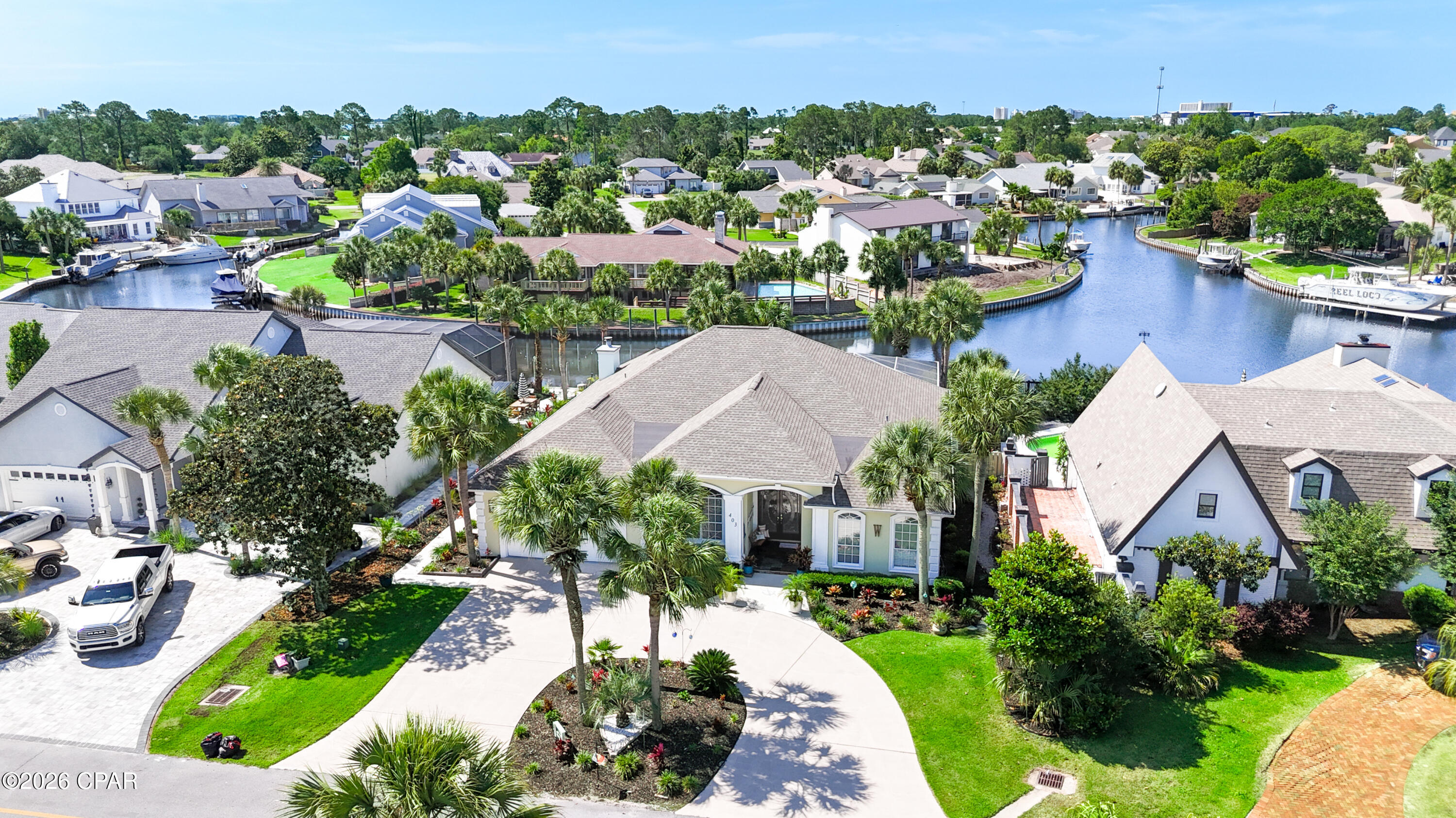 Welcome to waterfront living in the highly sought-after gated community of Bay Point! Located on a canal with direct access to St. Andrews Bay and the Gulf in just minutes, this beautifully remodeled 4-bedroom, 2.5-bath home offers the perfect blend of luxury, comfort, and coastal lifestyle.

Situated at approximately 9 feet above sea level, this home has been extensively remodeled and updated throughout with new interior and exterior paint, renovated finishes down to the last ceiling fan and light fixture, granite countertops in the kitchen and all bathrooms, contemporary backsplash accents, and a beautiful gas fireplace with a modern setting. The spacious interior features soaring 10 and 12-foot ceilings with extensive crown molding, creating an open and elegant feel throughout the home. 

Designed for both comfort and peace of mind, the home includes a built-in 10,000-watt generator capable of powering most of the home during outages, a new 17 SEER 5-ton Rheem HVAC system installed in 2025, new water heater in 2024, and a 30-year architectural roof installed in 2019. Additional features include a designer shower in the guest bath, air-conditioned garage, new Whirlpool refrigerator in the kitchen, and an additional GE side-by-side refrigerator in the garage. 

Step outside into your own tropical paradise featuring lush updated landscaping, automatic irrigation system, heated pool with new 2024 heat pump pool heater, spacious pool lanai, and canal frontage complete with a boat lift equipped with remote control operation. The Bay Point canal system provides easy boating access to St. Andrews Bay and the Gulf within minutes. 

Bay Point offers gated security along with incredible amenities including a full-service marina, restaurant, golf, tennis, and a true coastal lifestyle just minutes from everything Panama City Beach has to offer.

This is more than just a home -- it's a lifestyle.
