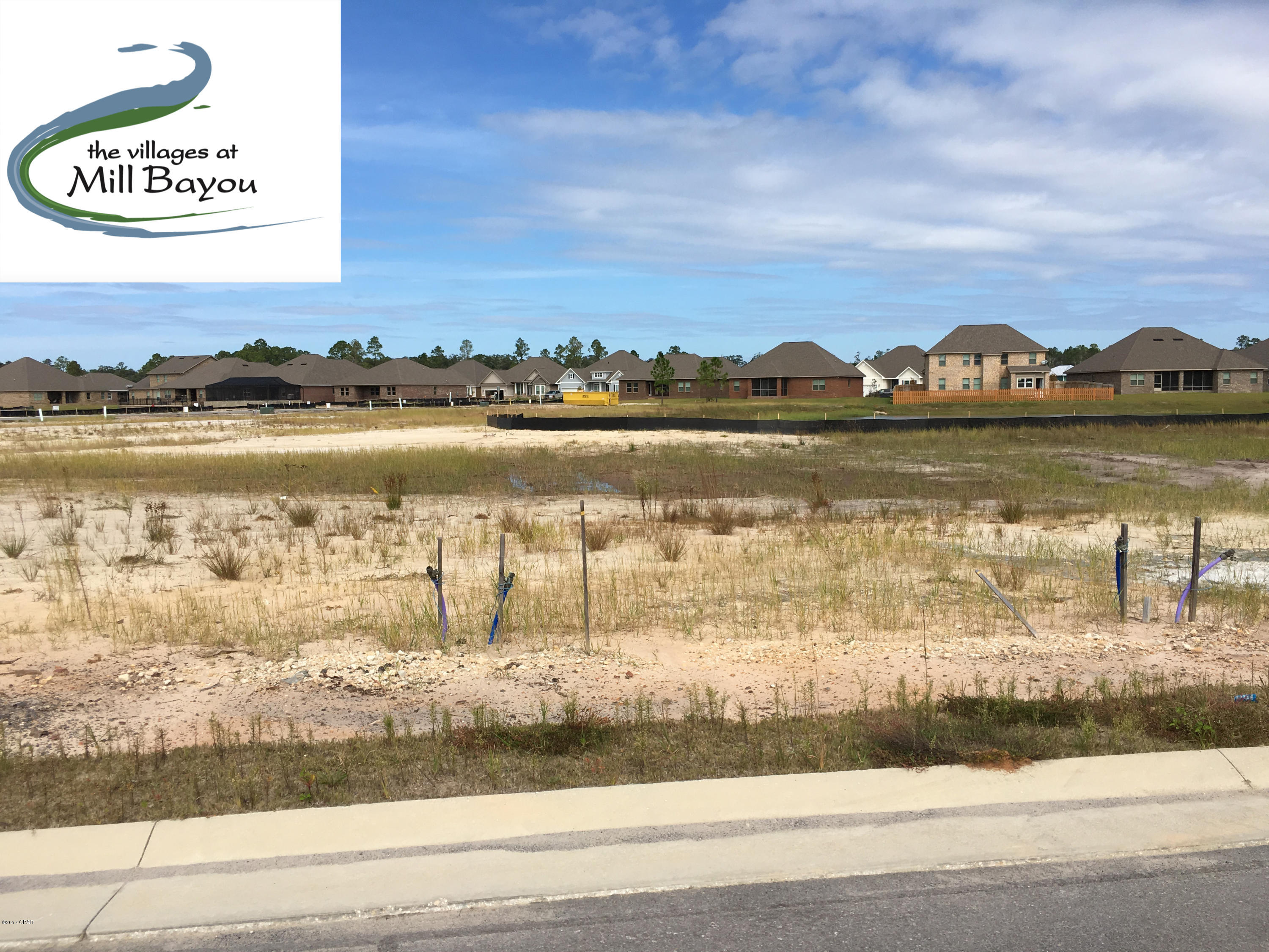 Build your home in Lynn Haven on this lot that backs up to Saw Grass Pond and walk down to the HOA maintained park areas on the bayou. Neighborhood has pool, firepit, sidewalks, street lights, wide streets for on street parking, 2 dedicated parks, conservation land, and ponds throughout. The development contains Deerpoint elementary on the north and North Bay Haven Charter Academy within walking distance on the south. Lot has potable water, reuse for low cost lawn and landscape irrigation, power, sewer, and natural gas.