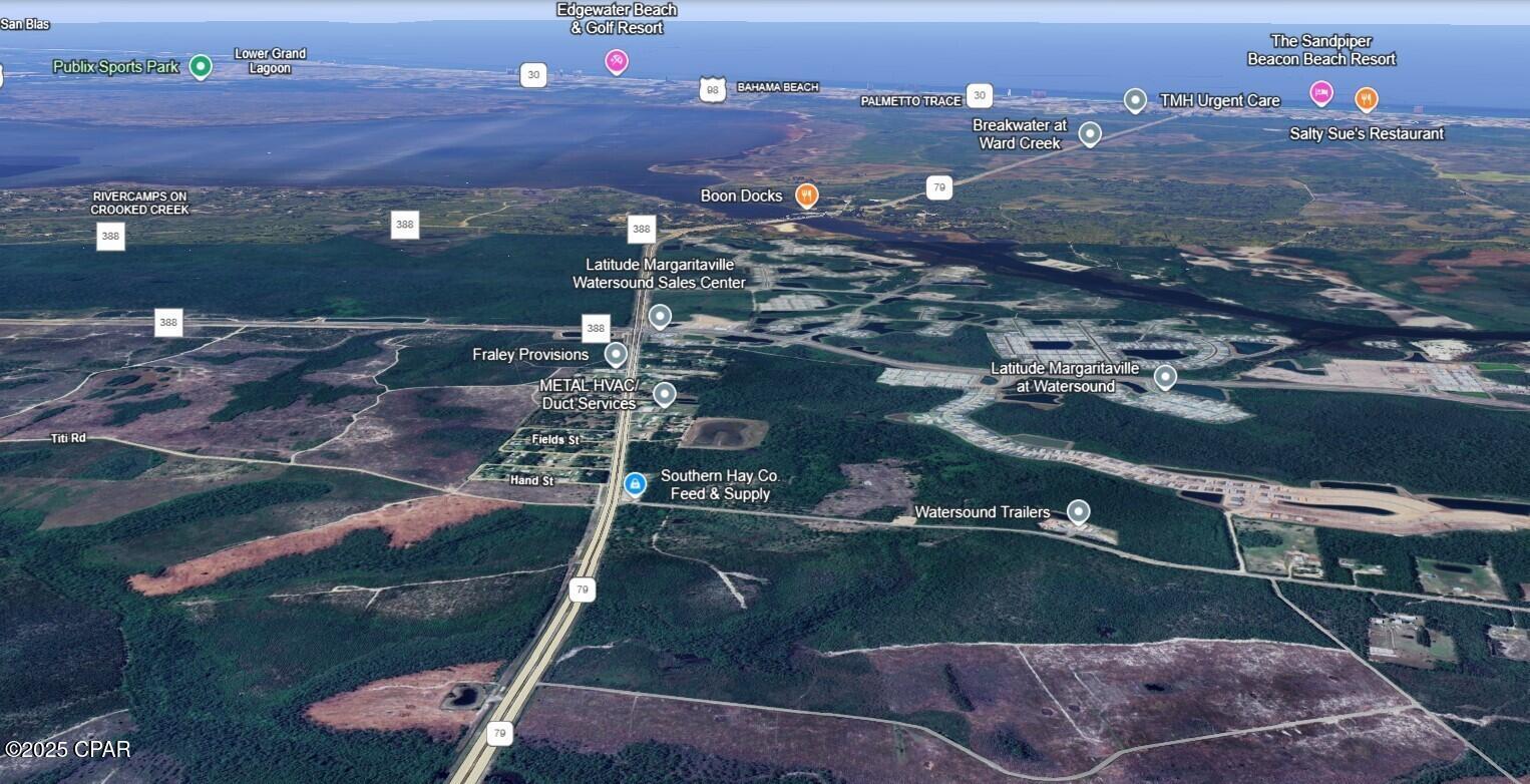 Do miss your opportunity to purchase property on Hwy 79.  Commercial 2 Acre (1.992) Parcel of Land.  Located on corner of Hwy 79 and Burns St. with approx 208 feet facing Hwy 79.  Located in premier developing area of Hwy 79.  Zoned 'VC' Village Center.  Zoning categories under VC are R5, C1, C2 and C4.  Property is 1.5 miles north of Latitudes Margaritaville Community Subdivision and Hwy 388.  Large Developments currently being built in this area.  Property is 15 minutes to Panama City Beach and 12 minutes to Northwest Florida International Airport.  1 HR 54 minutes to Tallahassee, FL.  1 HR 48 to Pensacola, FL.  Recorded address of property is 8409 Burns St. Panama City Bch, FL. 32413