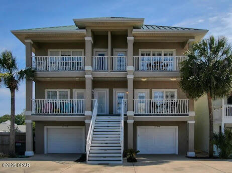 Wake to breathtaking Gulf sunrises from the private primary suite balcony and enjoy effortless sunset beach walks just across the street. This upscale coastal residence offers 4 bedrooms and 4 bathrooms, each enhanced with custom plantation shutters.

Designed for refined living and exceptional flexibility, the home features a private guest quarters with approximately 500 sq ft of living space, elevator access to all three levels, dual washer/dryer hookups, granite countertops, stainless steel appliances, crown molding, and elegant finishes throughout.

The primary suite is a serene retreat showcasing tray ceilings, a spa-inspired bath with double vanity, and a luxurious jacuzzi tub. Short-term rentals are permitted with no HOA restrictions, presenting a rare opportunity for luxury coastal ownership or investment.