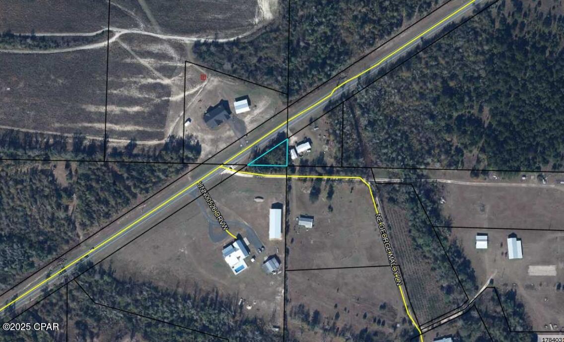 Vacant lot located directly on a paved highway with approximately 175 feet of frontage. Great visibility and easy access, ideal for signage, parking, or future use.. Buyer to verify zoning and intended use.