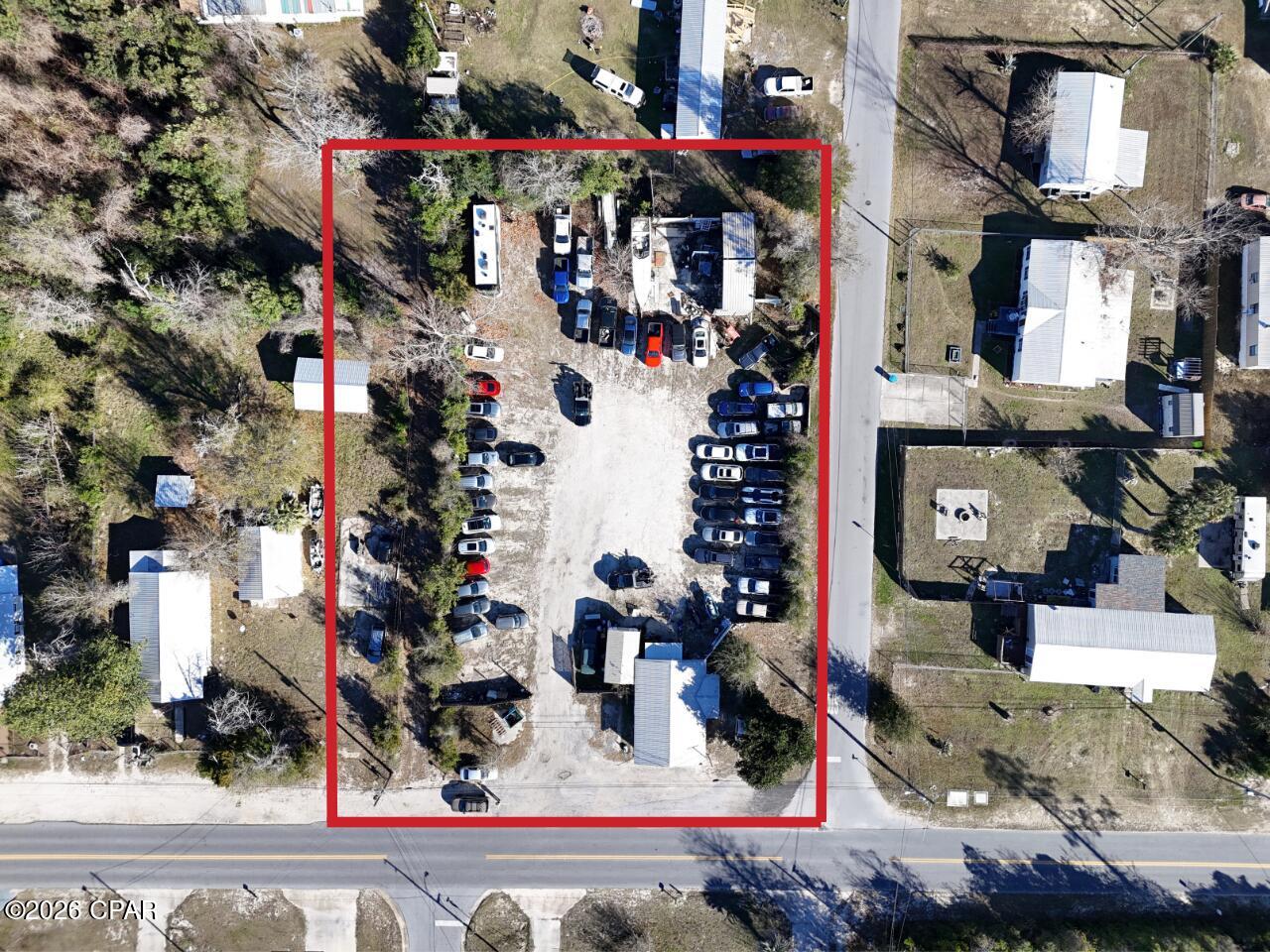 Exciting Investment Opportunity for your growing business! This large corner lot is designated as Mixed Use and is in a very convenient central area. Currently used for vehicle storage and office space, there are a lot of options for your future business location. 

The office is open concept with storage in the rear of the building. This concrete block building was built to last and has an updated bathroom, split-unit HVAC system, and sturdy metal roof. 

A 32' x 48' slab is in the rear, with plumbing and sewer connection, ready for your warehouse or shop. Previous building damaged from Hurricane Michael. 

If this location and size work for you, let's discuss how we can make it the right fit! 

Showings allowed during open hours due for security reasons. Sale is for land and building only, the business does not convey. Business is moving within 30-60 days. 

Recent survey Available.