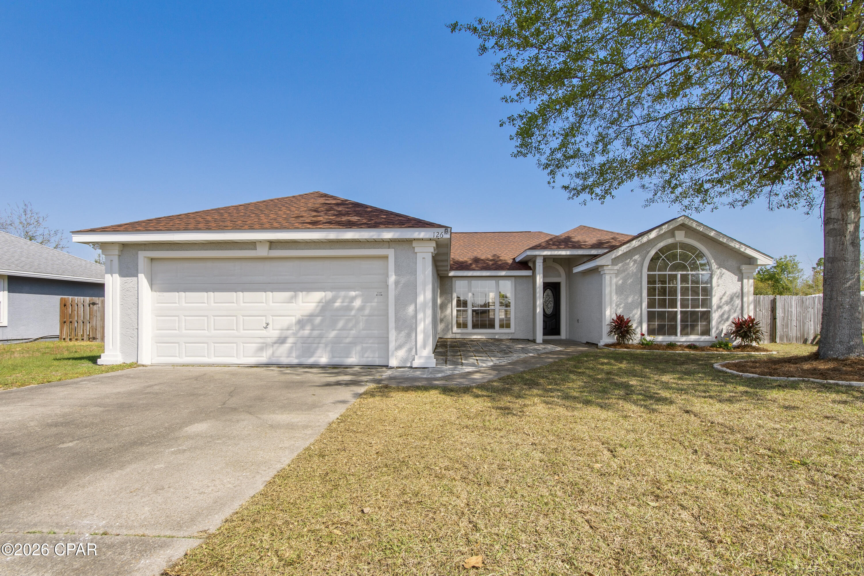 Charming, fully remodeled home in popular Brittany Woods--with NO HOA! This home has been completely updated inside and out, featuring new appliances, luxury vinyl plank flooring throughout, and beautifully renovated bathrooms, offering a clean, modern feel from top to bottom.
The open floor plan provides a spacious layout while still maintaining defined living areas, all enhanced by durable and stylish LVP flooring that flows seamlessly throughout the entire home.
The eat-in kitchen includes a pantry, dishwasher, range, and microwave, paired with updated finishes that make the space both functional and inviting. A cozy fireplace anchors the large living room, creating a warm focal point.
The master suite features an adjoining 9x8 flex room--perfect for a home office, nursery, or workout space. Double doors lead into the updated master bath and a spacious 7x8 walk-in closet. On the opposite side of the home, you'll find two generously sized bedrooms, separated by a guest bath and laundry closet. The front bedroom offers a beautiful cathedral ceiling.
Step outside to enjoy the privacy-fenced backyard, ideal for relaxing or entertaining. Brittany Woods is a welcoming neighborhood with sidewalks and a walking park at the entrance. Conveniently located near Walmart, schools, Tyndall AFB, and town--and best of all, no HOA restrictions or fees!