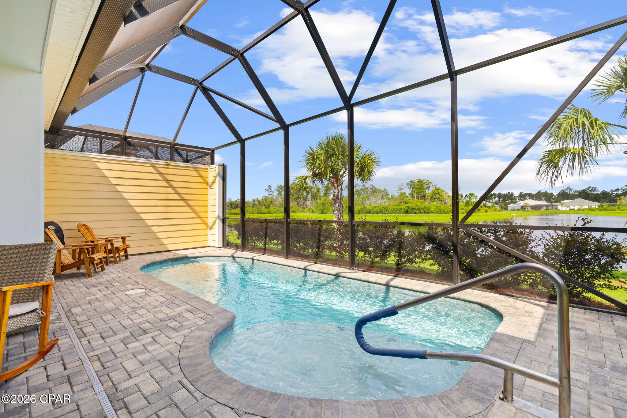 ''Jamaica'' Villa Home in Phase 2, VERY CLOSE to the AMENITIES, the INTRACOASTAL WATERWAY, and only 7 miles to the Beautiful WHITE SANDY BEACH on the GULF! ~ Do you want to make your FRIENDS JEALOUS... Change your Latitude to... Latitude M'ville WaterSound 55+ Community with AMENITIES that AMAZE the ''ACTIVE'' Owners. This Community has an AMAZING ZERO ENTRY PARADISE POOL but if you want your PRIVACY, no worries, this Jamaica Villa even has its own PRIVATE HEATED POOL on the Screened in Lanai, right out your back door. This 2 Bedroom also has an added ''Bonus Room'' a DEN with Glass Doors so you can quietly work but not miss anything happening in the home. The KITCHEN has Gas & Electric hook-ups, Double Oven Range, Double Trash Pull Out, Cabinets with Pull Out Shelves, Pots & Pans Drawer, Quartz Countertop, 42'' Cabinets, and a Water Purifier at the Kitchen Sink. The MAIN BEDROOM - is very Spacious with a Private Bathroom that features a Tiled Walk-in Shower and Quartz Countertops. The Walk-in Closet has ample room for everything you need. The Living Area has Sliding Doors that open up to the Lanai and offers a BEAUTIFUL VIEW to your own POOL and the LAKE out back. The Guest Bedroom is at the other end of the home, so everyone has their own space and Bathroom. The 2 Car Garage also has a UTILITY SINK and a Beautiful Epoxy Floor. All the Appliances will remain, to include the Washer & Dryer. You don't have to worry about the Lawn, Landscaping, Exterior Paint, or the Roof Replacement; the HOA is responsible for those items, when they determine they are needed. There is also a 10 year ''Structural Warranty'' from the Builder, that started from the original build date. *** You will love all the Unbelievable AMENITIES including the 2 Story BAR & CHILL Restaurant with 3 Bars, Large Oasis Pool, 10 Pickleball Courts, Tennis Courts, Outdoor Pool Table, Ping Pong Table, Putting Green, Bocce ball, Cornhole, Fins Up Fitness Center, Indoor Lap Pool & Indoor Whirlpool, Last Mango Theater, The Hanger Wood Workshop, Pottery, Barkaritaville Pet Spa, Walking Trails, and Live Music by the Pool, the Restaurant, and at the Bandshell. You are only 5 miles from the NEW HOSPITAL & DR OFFICES. There will also be a PUBLIX right at the ENTRANCE to YOUR NEW HOME COMMUNITY. Bring your Fancy Golf Cart and join the Fun Filled Community!!!