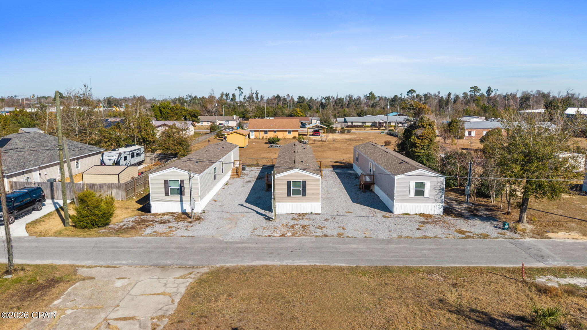 All units are currently leased please do not disturb tenants.  Investment Opportunity! This is a turnkey Mobile Home Park for sale that is located in the heart of Panama City. All three 2023 homes are like new and ready to go! The property is easily accessible and is convenient to Tyndall Air Force Base. This setup is streamlined to be income producing. Whether you are an experienced Investor or just entering the mobile home park space, this property could offer long-term potential. Contact your favorite realtor today to schedule your showing.