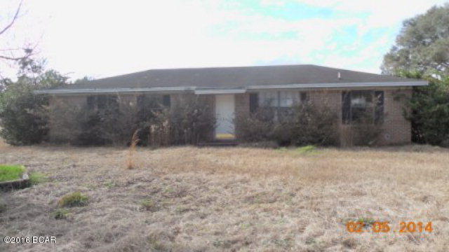 GREAT COUNTRY HOME IN GRACEVILLE. 4 Bedrooms 1.5 Bath Brick house with just under 1300 sq ft! Located on 2 acres on Hwy 77 with workshop! Open floor plan with breakfast bar in kitchen. Tile flooring and carpeting. Built in entertainment center in the family room. Detached 1 car garage. Home needs some updates but would make the perfect home or rental! Sold AS-IS.