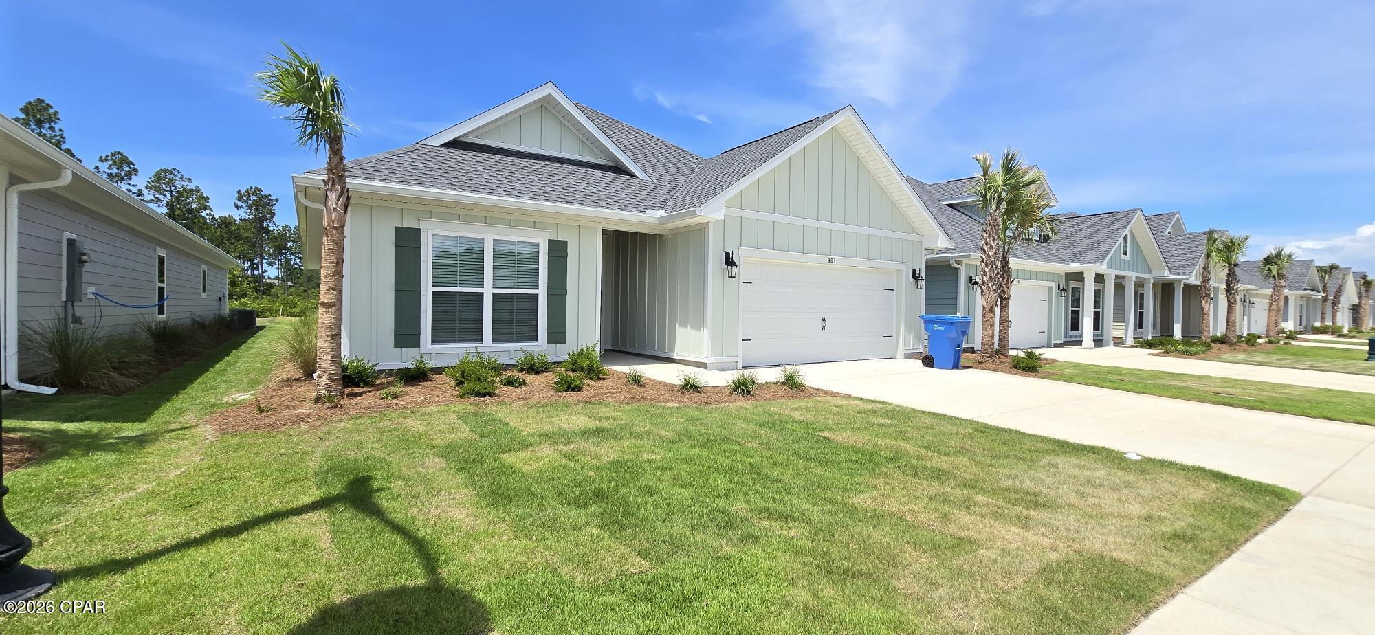 Welcome to 901 Crystal Bayou Boulevard, a new home at Breakfast Point East in Panama City Beach Florida. This home is ready for move in and features 2,300 square feet of naturally lit open living space and modern finishes. As you enter this home you will find a foyer with EVP flooring leading you past the first of three guest bedrooms and the guest bathroom. 

Continuing to the heart of the home, a large open concept living area awaits filled with natural light from the many windows and high ceilings. The kitchen has a center island and is open to the dining and living areas. Elegantly appointed, it is designed with quartz countertops, Herringbone tile backsplash, EVP flooring, and a single basin undermount sink in the island. Just off the kitchen, you'll find a secluded hall leading to the primary bedroom. An exceptional feature of this home includes a gas cooktop stove. 

Located in a private area of the home, this bedroom offers high ceilings and large windows. The luxurious primary bath is complete with an oversize tile shower, a dual sink vanity with quartz countertops, and a large walk-in closet with shelving. The laundry room is also conveniently located at the other end of the hallway. All three guest bedrooms can be found on the other side of the home along with the two full guest bathrooms. 

Beyond the interior features and details, every home is equipped with Smart Home Technology. This thoughtful integration of technology ensures that your new home is perfectly designed to meet the demands of modern life.