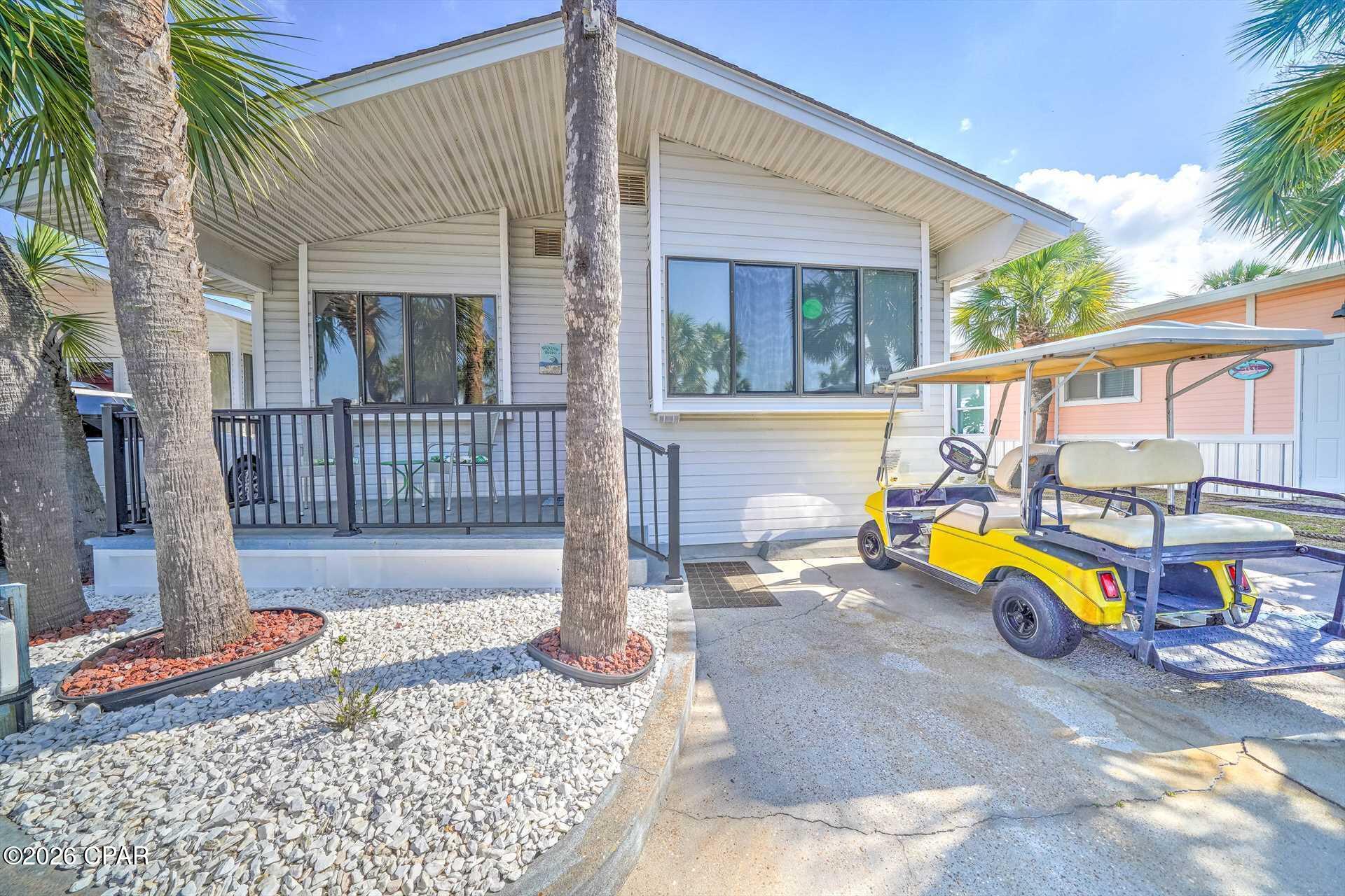 Welcome to your slice of paradise in the highly sought-after gated community of Venture Out in Panama City Beach! This beautifully maintained 2-bedroom, 2-bath home offers the perfect blend of comfort, functionality, and coastal charm--with additional space that could easily serve as a bunk room, making it ideal for maximizing rental potential or accommodating extra guests.
Step inside to a bright and open living area filled with natural light, featuring durable vinyl plank flooring and a relaxed, beachy vibe throughout. The spacious living room flows seamlessly into the dining area and kitchen, creating an inviting space for entertaining family and friends.
The kitchen is well-appointed with ample cabinetry, generous counter space, and a convenient breakfast bar--perfect for casual dining. Just off the main living area, you'll find two comfortable bedrooms, including a primary suite. The additional flex space offers great potential for a bunk room, office, or extra sleeping area.
Enjoy the Florida lifestyle outdoors with a welcoming exterior space and room for parking--plus the convenience of a golf cart-friendly community, making it easy to cruise down to the beach or around the resort.
Venture Out amenities include:
• Private beach access to the Gulf of Mexico (just a short golf cart ride away)
• 300' of Gulf frontage & 1,000' on Grand Lagoon
• Two swimming pools (one heated seasonally)
• Tennis, pickleball & basketball courts
• Fishing pier, boat launch & marina
• Playground & picnic areas
• 24/7 gated security
Whether you're looking for a vacation home, investment property, or full-time residence, this home checks all the boxes. Venture Out continues to grow in popularity, making this a fantastic opportunity to own in one of Panama City Beach's most desirable golf cart communities.
Don't miss your chance to own in paradise--schedule your showing today!
