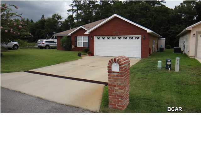 Beautiful brick, 3/2 home with solid bamboo wood floors (in all main living areas and the master) located on a cul de sac. The kitchen offers stainless steel appliances, garbage disposal, upgraded real wood cabinetry, accent lighting under cabinets, a purifying water filtration system, tiled backsplash and breakfast bar. The master bathroom features two walk in closets, two sinks and a tiled standing shower with two shower heads (each with independent water temperature controls). The home has crown molding, inside utility, the programmable 4-zone sprinkler system as well as the exterior faucets are connected to a well pump(saves monthly water costs), attic access, storage shed, 50 gallon programmable water heater and more. This home backs up to wooded property that cannot be built on.