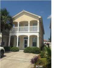 FEW steps to ''THE WORLD'S MOST BEAUTIFUL BEACHES'' and mesmerizing sunsets! Fabulous, beach house within the first block from the emerald green water. First floor features large great room, dining, 1/2 bath, kitchen, laundry, master bedroom and full bath with large closet. Second floor has another large master bedroom/bath, large 4 x 7 closet, two additional bedrooms and bath. Relaxation abounds with 6 x 18 porch on the ground floor and a 6 x 17 covered balcony outside the master bedroom on the second floor, both overlooking the lake across the street. Walk a few steps across Front Beach Road for fun-in-the-sun and the enjoyments of the sound of the waves rolling in, seagulls singing, and be mesmerized at days end by the golden sun as it sinks into the horizon. Convenient to  new International Airport, Pier Park with restaurants, shopping, and theatre, Panama City & Destin with more shopping & restaurants, amusement parks, watersports, and all activities that children, teens, and adults enjoy. Great full-time, second home beach get-a-way, and/or investment. Exterior of home was painted Feb 2015. Age, sq. ft., dimensions and measurements approximate, please verify if important.